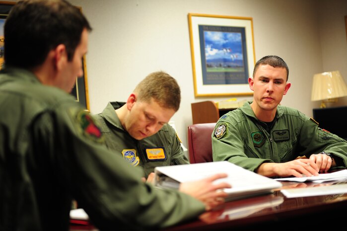 A C-17 Globemaster III aircrew from the 15th Airlift Squadron, Charleston Air Force Base, S.C., conducts a mission brief prior to an air delivery mission in support of Operation Unified Response, Jan. 20, 2010. (U.S. Air Force photo by Staff Sgt. Jacob N. Bailey / Released)