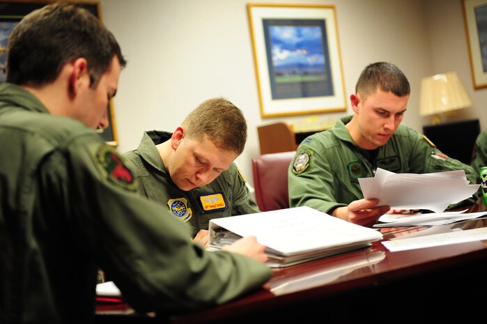 A C-17 Globemaster III aircrew from the 15th Airlift Squadron, Charleston Air Force Base, S.C., conducts a mission brief prior to an air delivery mission in support of Operation Unified Response, Jan. 20, 2010. (U.S. Air Force photo by Staff Sgt. Jacob N. Bailey / Released)