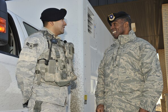 Brig. Gen. Jimmy McMillian, HQ USAF/A7S, chats with Airman 1st Class Jose Jasso before being shown the capabilities of the Z Backscatter Van, or ZBV, for short. The genearl was at Malmstrom for three days and spent most of his time visiting with his security forces personnel on the job. (U.S. Air Force photo/John Turner)