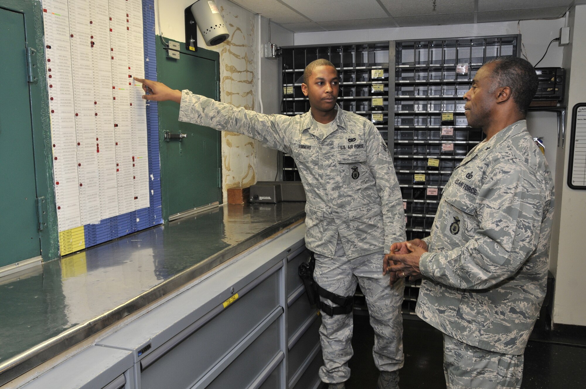 Senior Airman Christopher Summers explains the weapons issuing process to Brig. Gen. Jimmy McMillian Jan. 14 during the HQ USAF/A7S's visit to the Malmstrom armory. Airman Summers is a member of the 341st Security Support Squadron.(U.S. Air Force photo/John Turner)