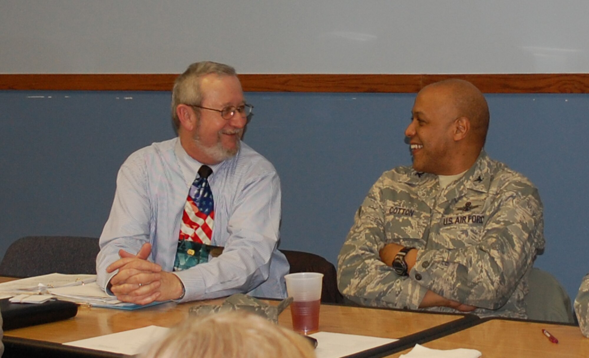 Col. Anthony Cotton, 341st Missile Wing vice commander, gets acquainted with Denis Miller, Retiree Activities Council director, while waiting to be served their food Jan. 15 at an appreciation dinner hosted by the Malmstrom First Sergeants Council. (U.S. Air Force photo/Valerie Mullett)