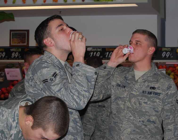 Airmen 1st Class Steven Coalson and Kyle Michaels, 16th Munitions Squadron maintenance technicians, sampled smoothies at the commissaries nutritional informational session Jan. 13. The Airman who guessed the most ingredients in the smoothie won an iPod. (U.S. Air Force photo/Airman 1st Class Kristina Overton)