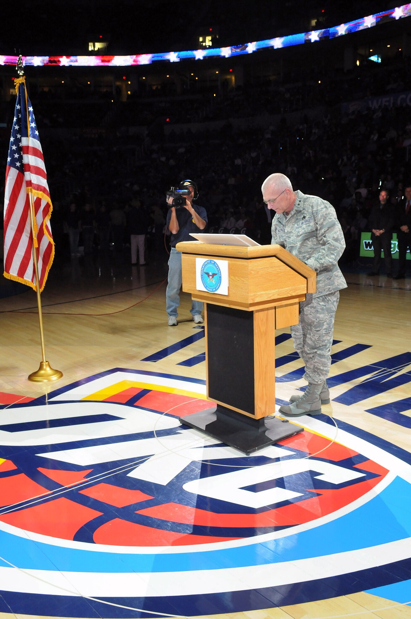 Maj. Gen. David Gillett, Oklahoma City Air Logistics Center commander, recently signed a community covenant during halftime at an Oklahoma City Thunder basketball game. The covenant is an Army initiative which evolved to include all services. The signing is meant to foster better relationships between the military and local community leaders who pledge their support to servicemembers and their families. Congressman Tom Cole, Navy Capt. Dwight Shepherd, Dr. Sharon Lease, Col. Anthony Johnson, Oklahoma City Mayor Mick Cornett, Brig. Gen. Roger Duff, Dr. Gib Gibson, Maj. Gen. Myles Deering, retired Maj. Gen Toney Stricklin, Oklahoma Lt. Gov. Jari Askins and Maj. Gen. David Halverson signed with General Gillett during halftime. Other federal, state, local and military leaders signed the covenant before the game. More than 85 signing events have taken place across the country. (Air Force photo by Dave Faytinger)
