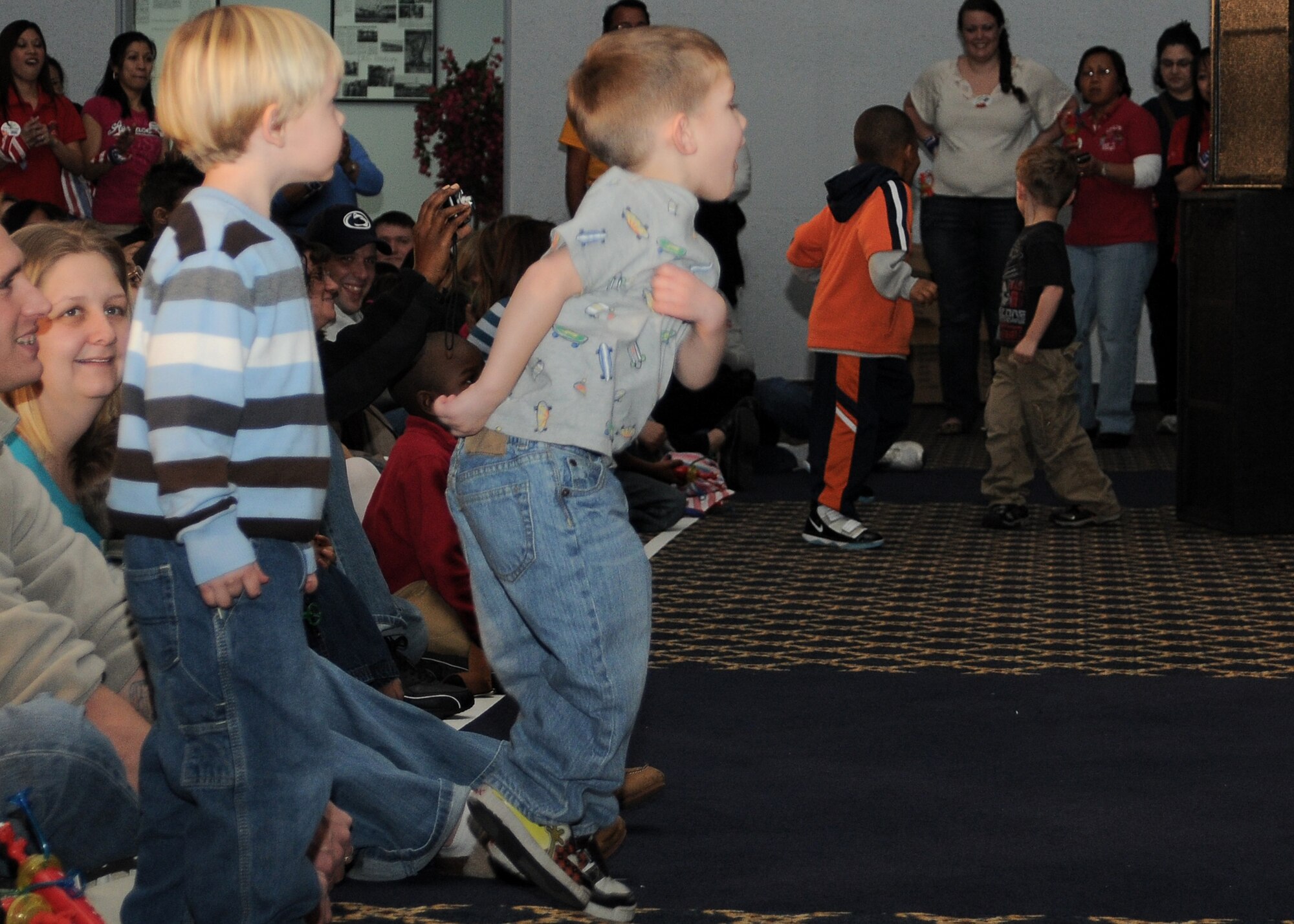 Yokota AB, Japan -- Children sing and dance along with Sesame Street characters during a USO sponsored Sesame "Talk, Listen, Connect" performance, Jan. 16 at the Taiyo Community Center.  (U.S Air Force photo/Airman 1st Class Katrina Menchaca)