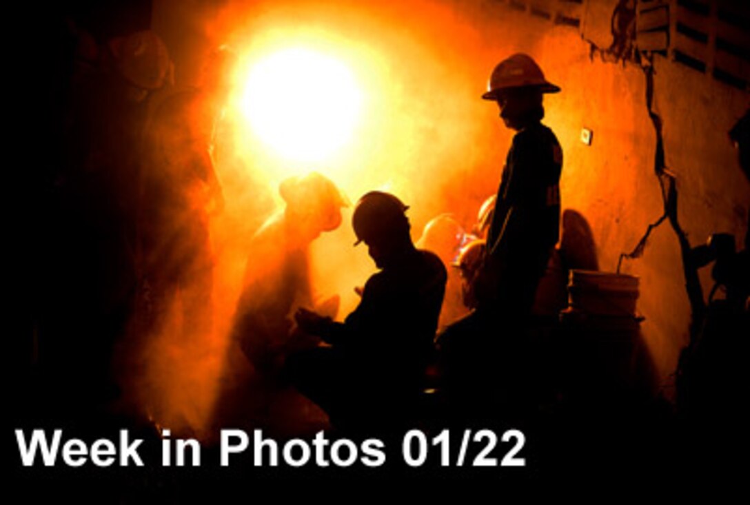 Air Force Week in Photos for Jan. 22, 2010, highlights photos from around the Air Force.  In this photo by Tech. Sgt. James L. Harper Jr., members of various rescue teams work to free a 25-year-old woman Jan. 19, 2010, who had been trapped in a collapsed building for seven days in Port-au-Prince, Haiti. (U.S. Air Force photo illustration)