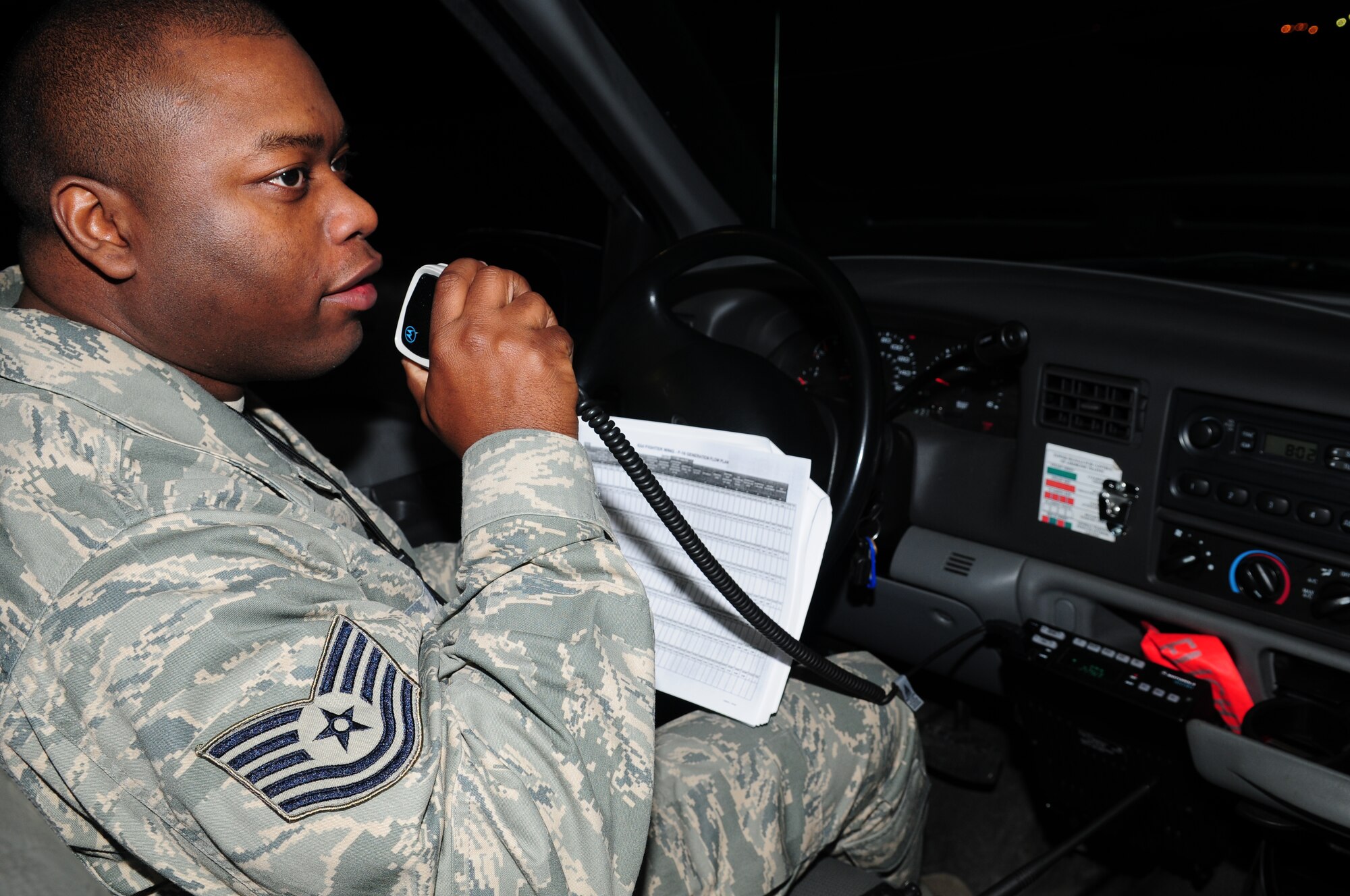 SPANGDAHLEM AIR BASE, Germany -- Tech. Sgt. Marcus Donald, 52nd Fighter Wing exercise evaluation team member, radios EET members prior to an F-16 Fighting Falcon generation during Operation Saber Crown 10-3 Jan. 20.  EET is responsible for the planning, preparation and evaluation of the base and its assets during phase one and phase two exercises. (U.S. Air Force photo/Staff Sgt. Heather M. Norris)