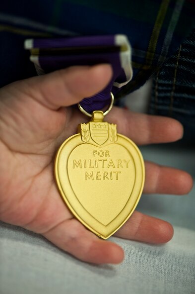 Now in Pensacola, Fla., where Golden is a flight commander helping to stand up a new combat systems officer school, he gets to enjoy playtime at the beach with Andrea and Odessa, now just over a year old. The flight surgeon who treated his wounds told him that if he hadn't been wearing his ballistic eyewear, he may never have gotten to see his baby girl. These days, Odessa holds her daddy's heart in her hand ... so to speak.(Photo by TSgt Samuel Bendet)
