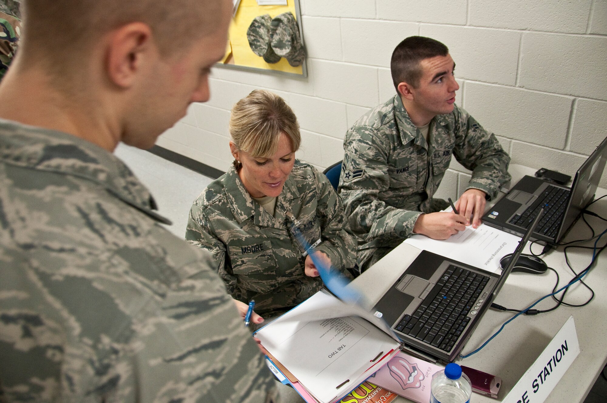Staff Sgt. Holly Moore, a financial services technician in the 123rd Airlift Wing, reviews mobility records Oct. 25 as part of the Personnel Deployment Function for a mobility exercise held at the Kentucky Air National Guard Base in Louisville, Ky. (U.S. Air Force photo by Maj. Dale Greer)
