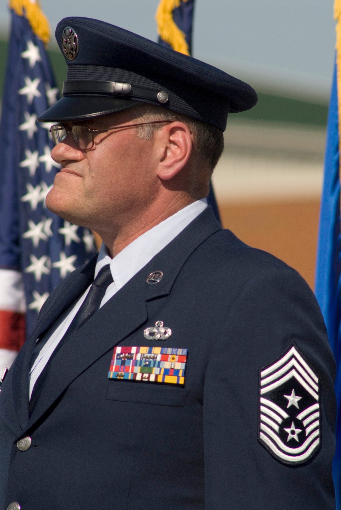 123rd Airlift Wing Command Chief Master Sgt. Tommy Downs, shown here during a 2007 change-of-command ceremony, was remembered as the epitome of "service before self" at a memorial service for him held Dec. 17, 2009, at the Kentucky Air National Guard Base in Louisville, Ky. Chief Downs died Dec. 12 from complications of pancreatitis. (U.S. Air Force photo by Tech. Sgt. Dan Clare)