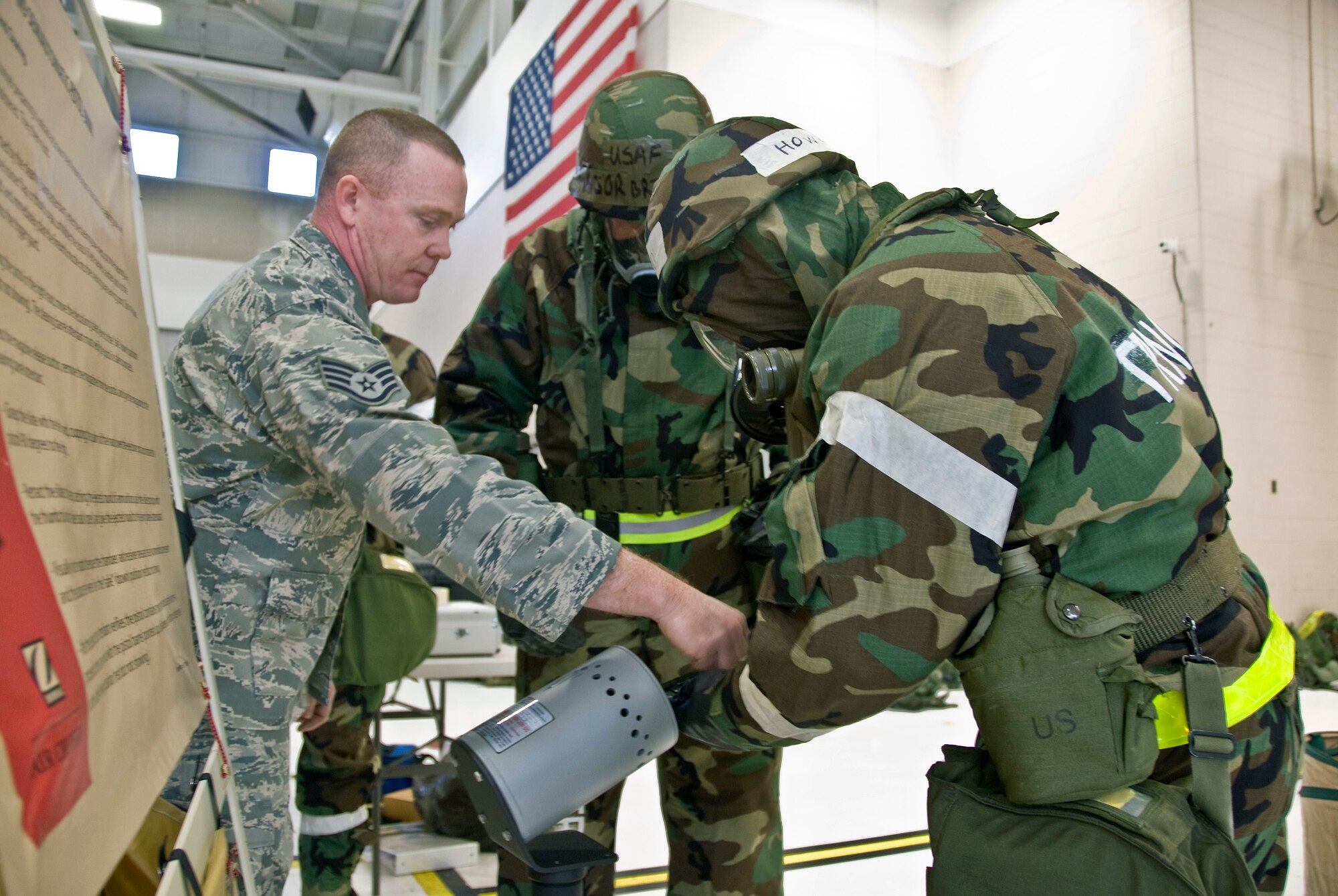 Staff Sgt. Craig Davis of the 123rd Security Forces Squadron demonstrates how to clear an M-9 pistol of live ammunition during decontamination training held Dec.    12, 2009, at the Kentucky Air National Guard Base in Louisville, Ky. (United States Air Force by Senior Airman Maxwell Rechel)