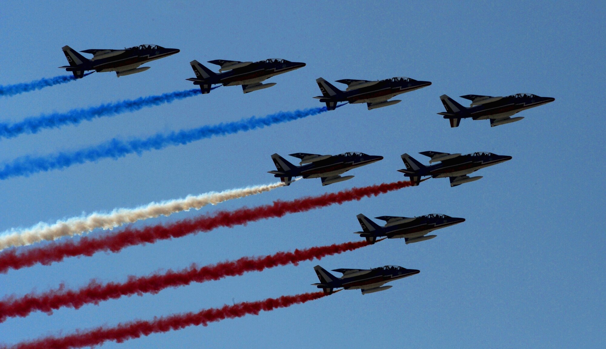 The French Air Force demonstation team, Patrouille de France, starts Bahrain's inaugural airshow with a flyby displaying their national colors, Jan. 23, 2010. (U.S. Air Force photo/ Staff Sgt. Angelita Lawrence/released)

