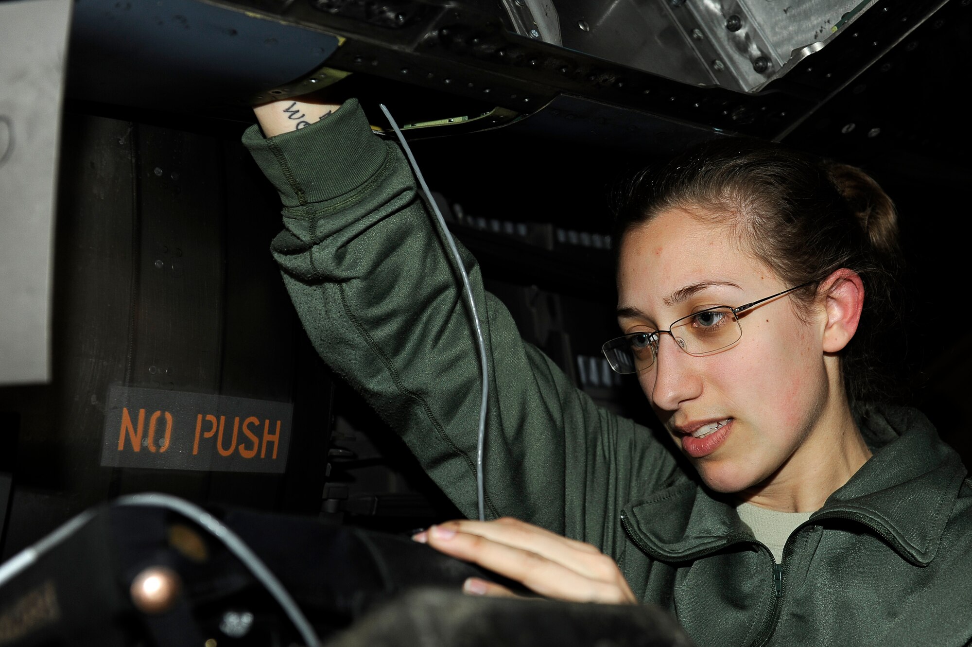 BAGRAM AIRFIELD, Afghanistan--U.S. Air Force Staff Sgt. Victoria Bader, 455th Expeditionary Maintenance Squadron, checks an F-15E for cracks on Bagram Airfield Jan. 23, 2010. Bader is deployed from Royal Air Force Lakenheath, England, and is from Atoka, Tenn. (U.S. Air Force photo by: Tech. Sgt. Jeromy K. Cross/released)


