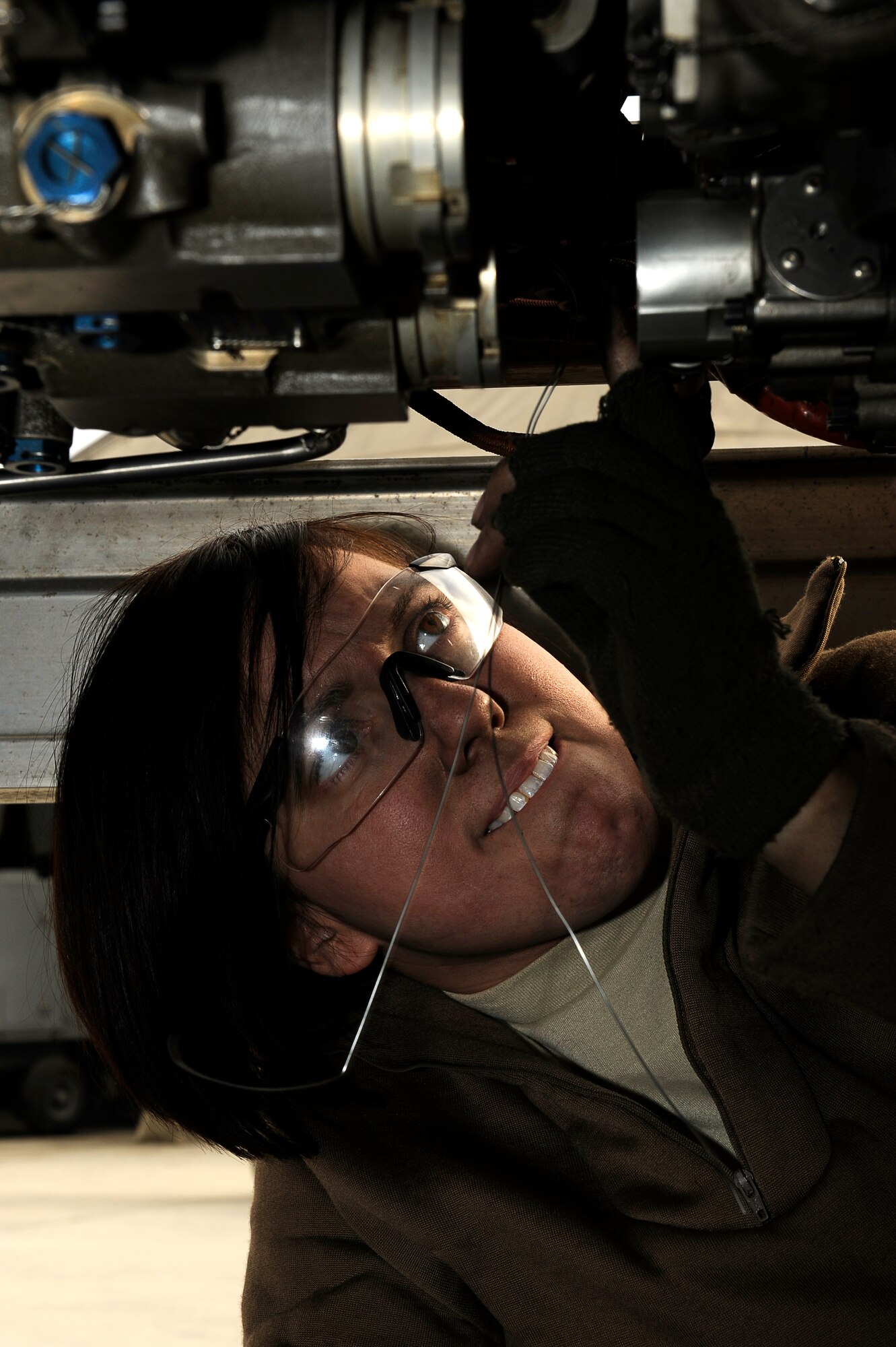 BAGRAM AIRFIELD, Afghanistan--U.S. Air Force Staff Sgt. Kelly Kollmar, 455th Expeditionary Aircraft Maintenance Squadron, repairs an F-15E engine on Bagram Airfield Jan. 23, 2010. Kollmar is deployed from Royal Air Force Lakenheath, England, and is from Buffalo, N.Y. (U.S. Air Force photo by: Tech. Sgt. Jeromy K. Cross/released)


