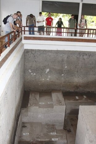 Marines look down into one of the excavation pits at the Ban Prasat Village. It has received international awards such as the Pacific Asian Travel Association’s Gold award in 1994. It is considered a success and pride for all the Thai people.