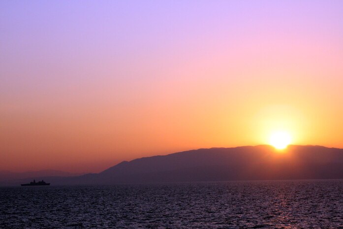 24th MEU Marines and Sailors woke this morning to watch the sunrise over the peak of a mountain range in Northern Haiti.  The 24th MEU stands poised to respond to any mission assigned to provide aid in Haiti.