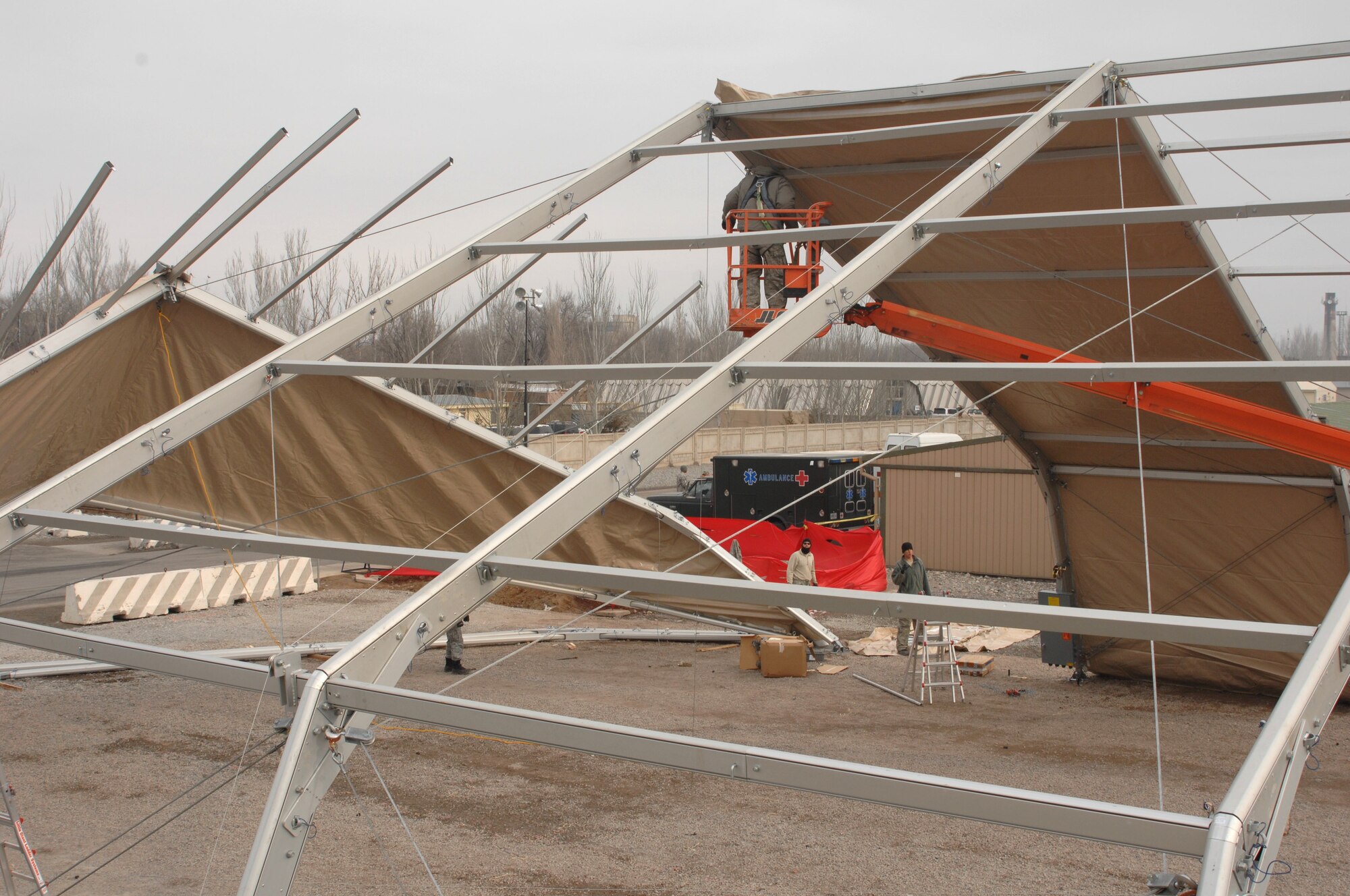 The J2 Basic Expeditionary Airfield Resources team builds a new 4K dome here Jan. 16, 2010. The tents will support Airmen, Soldiers, Sailors and Marines who pass through the Transit Center. The team, deployed from the 49th Material Maintenance Squadron, Holloman Air Force Base, N.M., travels the area of responsibility building structures. (U.S. Air Force photo/Senior Master Sgt. Mike Litsey/Released)