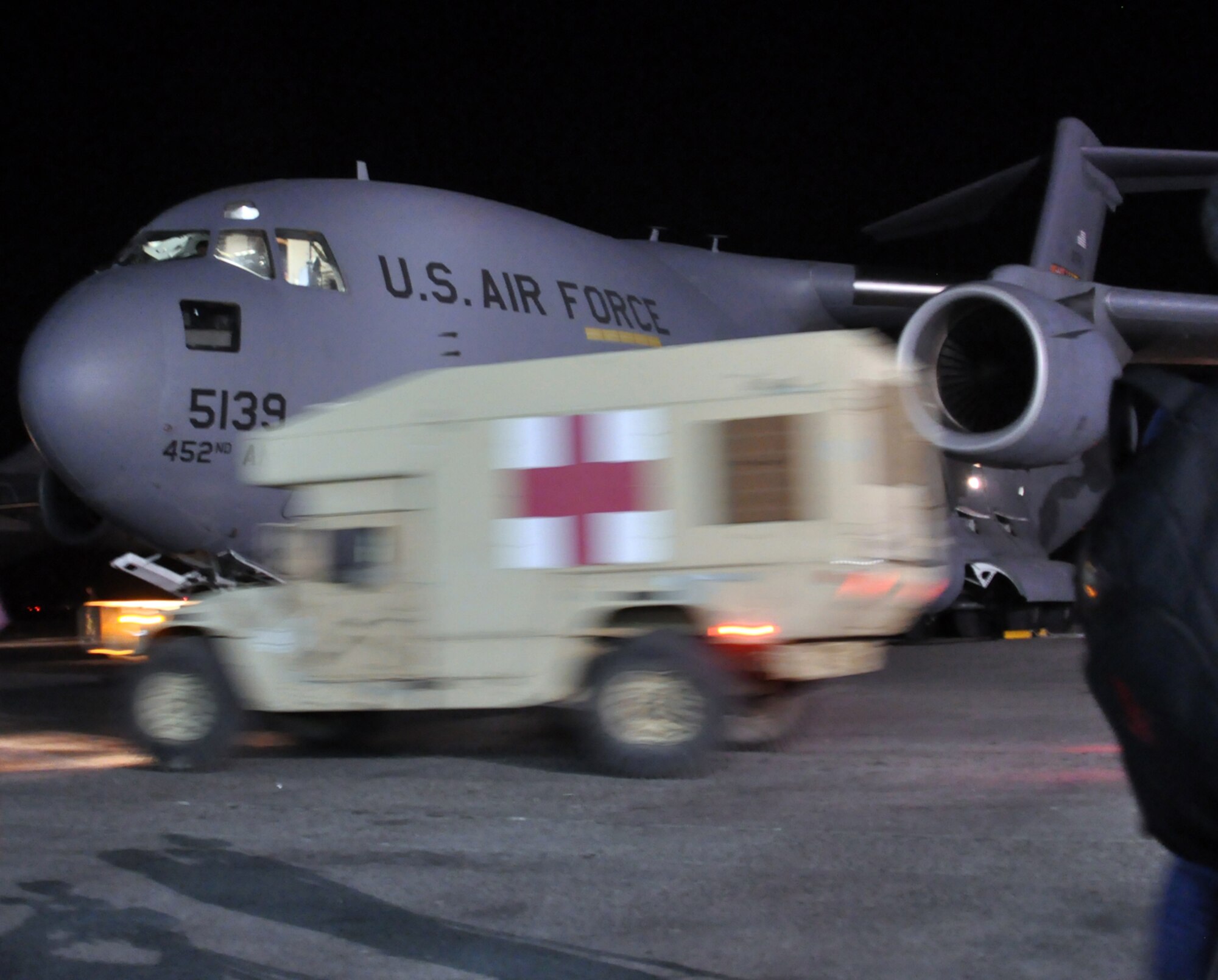A medical vehicle rushes across the ramp at the Port-au-Prince airport where 15 members of the wing’s 67th Aerial Port Squadron deployed Jan 22. (U.S. Air Force photo/Kari Tilton)