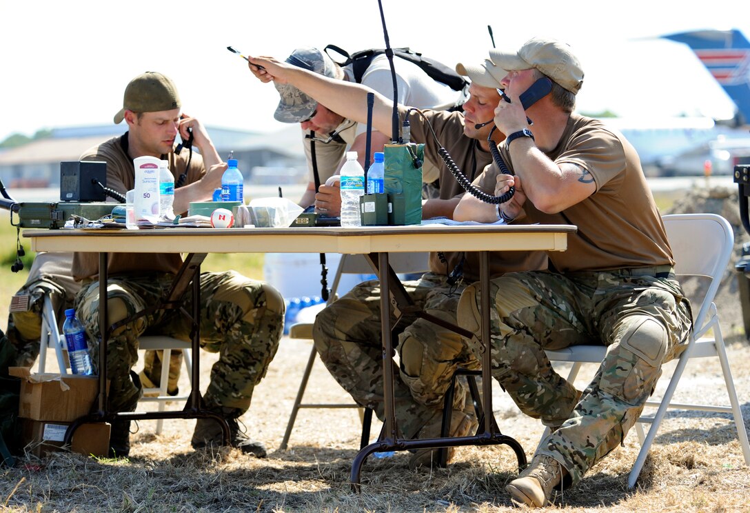 Combat controllers from the 23rd Special Tactics Squadron at Hurlburt Field, Fla., talk to aircraft circling the Toussaint L'Ouverture International Airport in Port-au-Prince, Haiti, Jan. 23, 2010. In the initial days of Operation Unified Response air operations were similar to the Berlin Airlift with aircraft landing every five minutes. Now, aircraft from all over the world are still flying in and out to drop off humanitarian aid and transport people out of the Haiti.  (U.S. Air Force photo/Staff Sgt. Desiree N. Palacios)