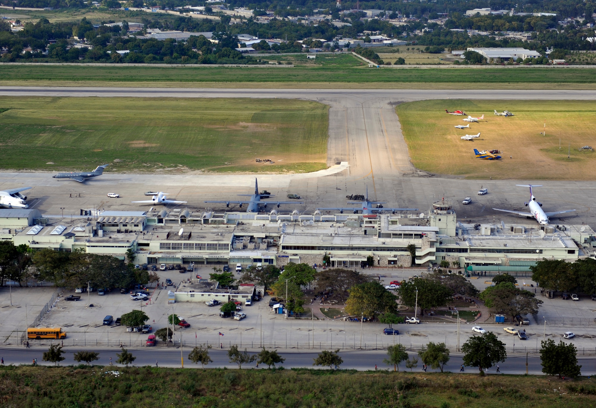 An aerial view shows Toussaint L'Ouverture International Airport in Port-au-Prince, Haiti, Jan. 23, 2010.  Aircraft from all over the world are flying in and out to drop off humanitarian aid and transport people out of the Haiti in the aftermath of the devastating earthquake that struck the country Jan. 12. (U.S. Air Force photo/Staff Sgt. Desiree N. Palacios)