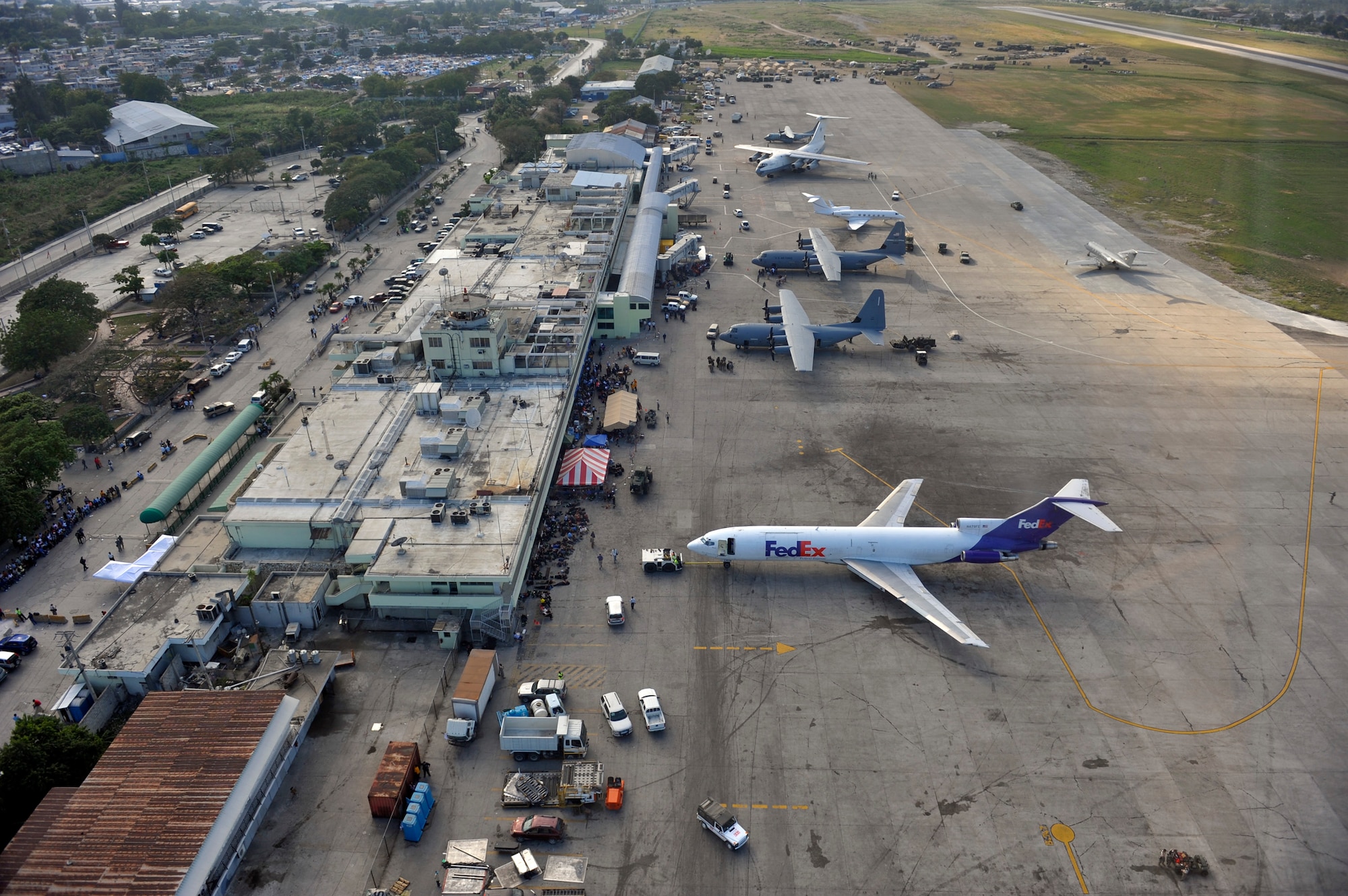 An aerial view shows Toussaint L'Ouverture International Airport in Port-au-Prince, Haiti, Jan. 23, 2010.  Aircraft from all over the world are flying in and out to drop off humanitarian aid and transport people out of the Haiti in the aftermath of the devastating earthquake that struck the country Jan. 12. (U.S. Air Force photo/Staff Sgt. Desiree N. Palacios)