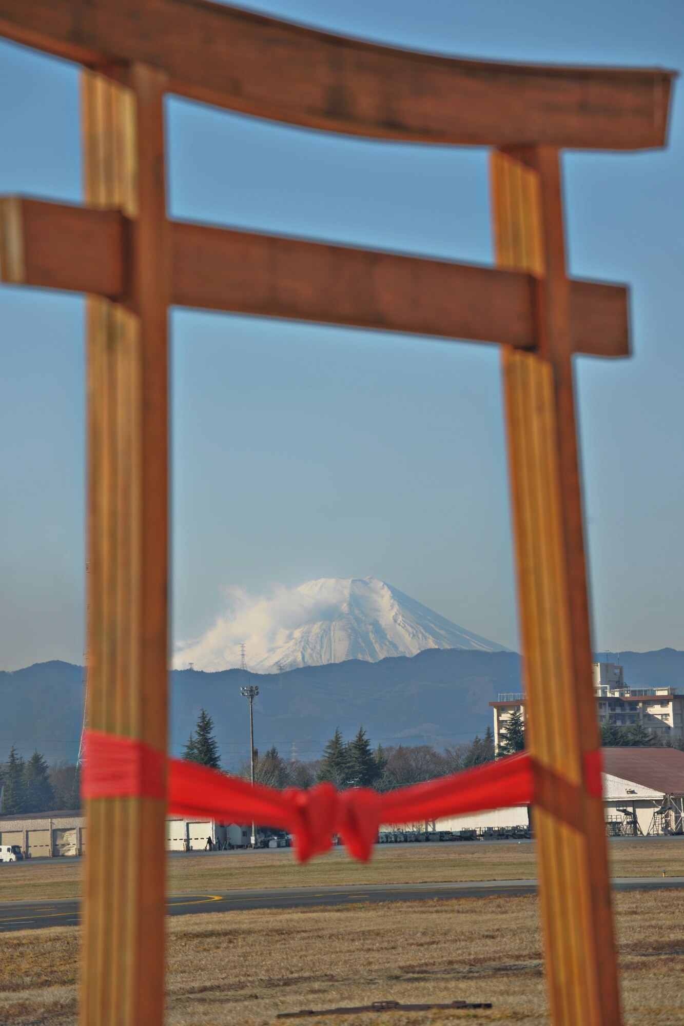 YOKOTA AIR BASE, Japan -- A Torii gate stands under Yokota's newest Air Traffic Control facility, Jan. 22. (U.S. Air Force photo/Osakabe Yasuo)