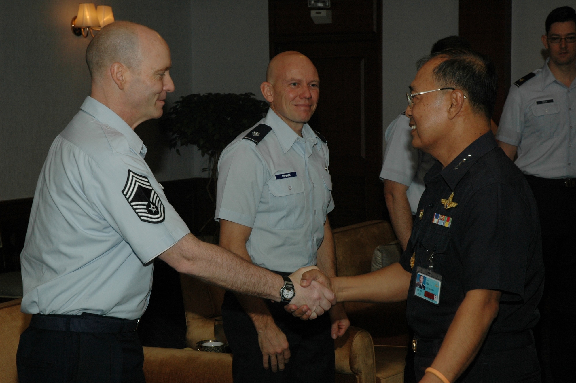 Air Chief Marshal (Gen. equivalent) Kanit Suwannate, assistant commander-in-chief, Royal Thai Air Force welcomes Chief Master Sgt.  James D. Riley, chief loadmaster, and Lt. Col. James M. Steward, chief of flying safety, with the Air Force Reserve’s 302nd Airlift Wing in Don Muang Royal Thai Air Force Base.  Seven members of the Air Force Reserve’s 302 AW, based at Peterson AFB, Colo. traveled to Don Muang Royal Thai Air Force Base, Thailand to provide expert training to RTAF members on safe and effective MAFFS operations.  This event marks the first time the Air Force Reserve has sent delegates to train a foreign Air Force on use of the MAFFS equipment.  (U.S. Air Force photo/Capt. Jody L. Ritchie)