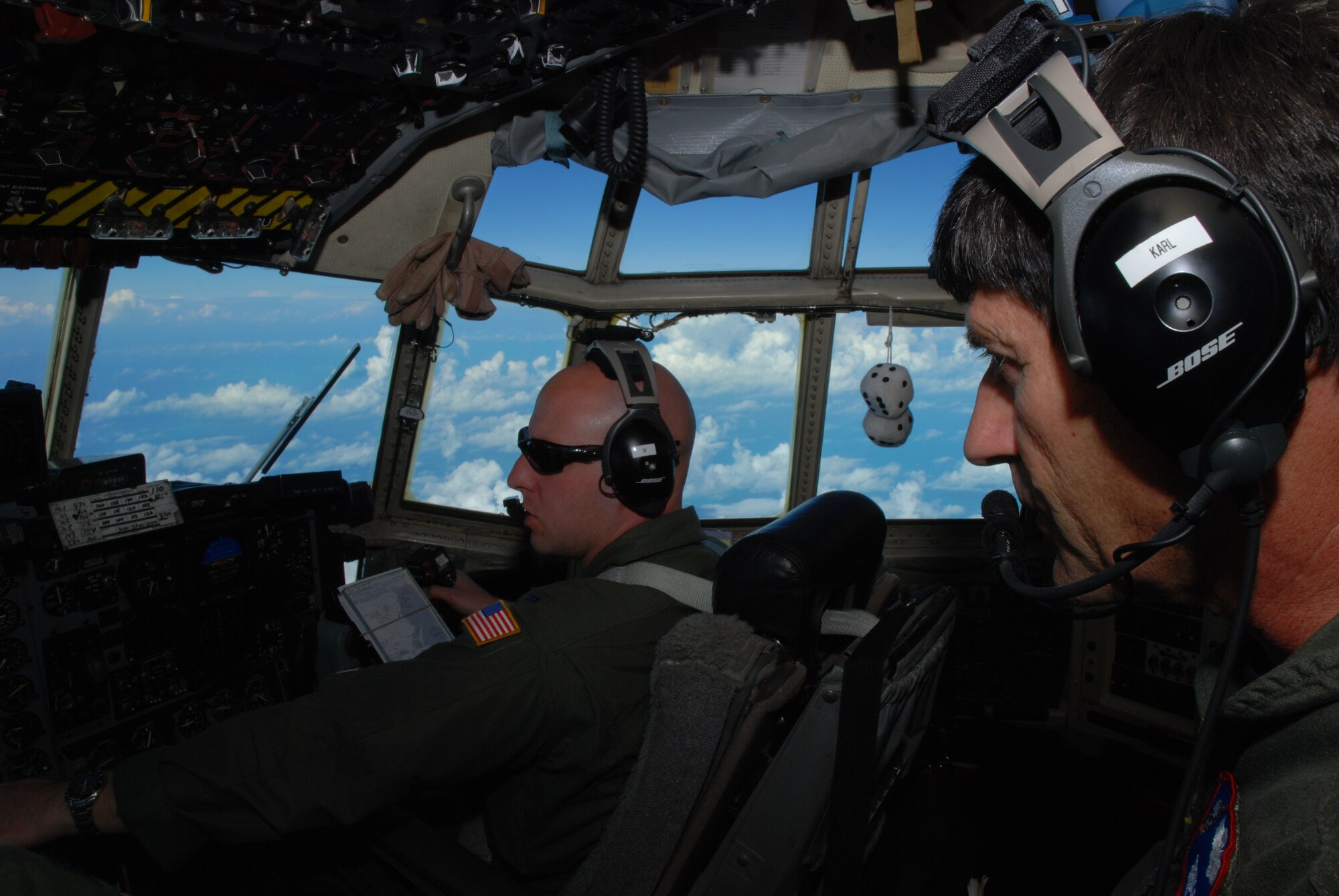 Senior Master Sgt. Dennis Karl, C-130 flight engineer, and 1st Lt.Casey Fallon, C-130 co-pilot, were serving on their Coronet Oak rotation with the 35th Expeditionary Airlift Squadron at Muñiz Air National Guard Base, Puerto Rico when an alert was issued after the earthquake in Haiti. Both Airmen are Guardsmen with the 179th Airlift Wing, Mansfield, Ohio.  Their Jan. 22 flight was their sixth mission in support of Operation Unified Response. (U.S. photo by Master Sgt. Stan Coleman)