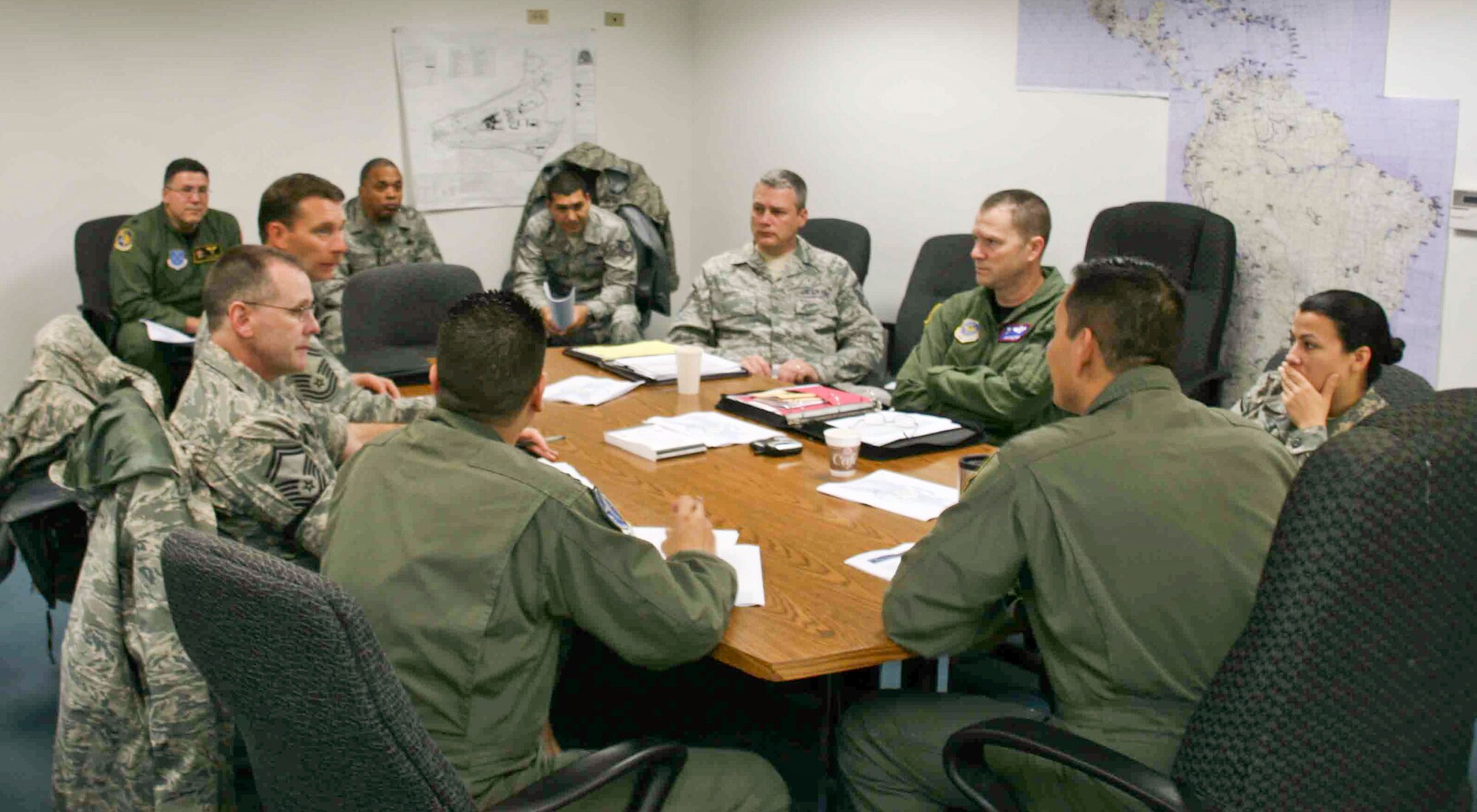 The 35th Expeditionary Airlift Squadron staff members met Jan. 13 with the
commander, Col. Julio Lopez after an alert was issued in preparation for a
humanitarian airlift response for the earthquake victims in Haiti. The 35th
is the command and control squadron for the Coronet Oak mission which
provides the United States Southern Command with logistic and contingency
support throughout Central and South America. (U.S. Air Force photo/Tech.
Sgt. Dennis Croak)
