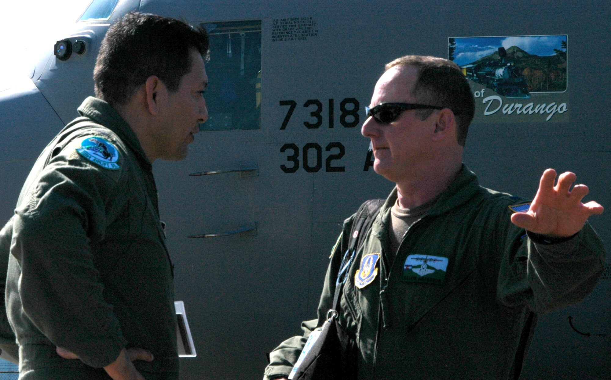 Lt. Col. Kelvin Anderson (right) coordinates with Col. Julio "Zorro" Lopez, 35th Expeditionary Airlift Squadron commander, after he and members of the Air Force Reserve's 302nd Airlift Wing arrived Jan. 23 at Muniz Air Base, Puerto Rico. Approximately 50 Airmen from the 302nd AW are deployed to the U.S. territory in support of Air Expeditionary Force Coronet Oak and its involvement with earthquake relief operations in Haiti. The Colorado-based AF Reserve Airmen are expected to be at Muniz Air Base for two weeks. Colonel Anderson is the mission commander for the deployed 302nd AW Airmen. (U.S. Air Force photo/Staff Sgt. Stephen J. Collier)
