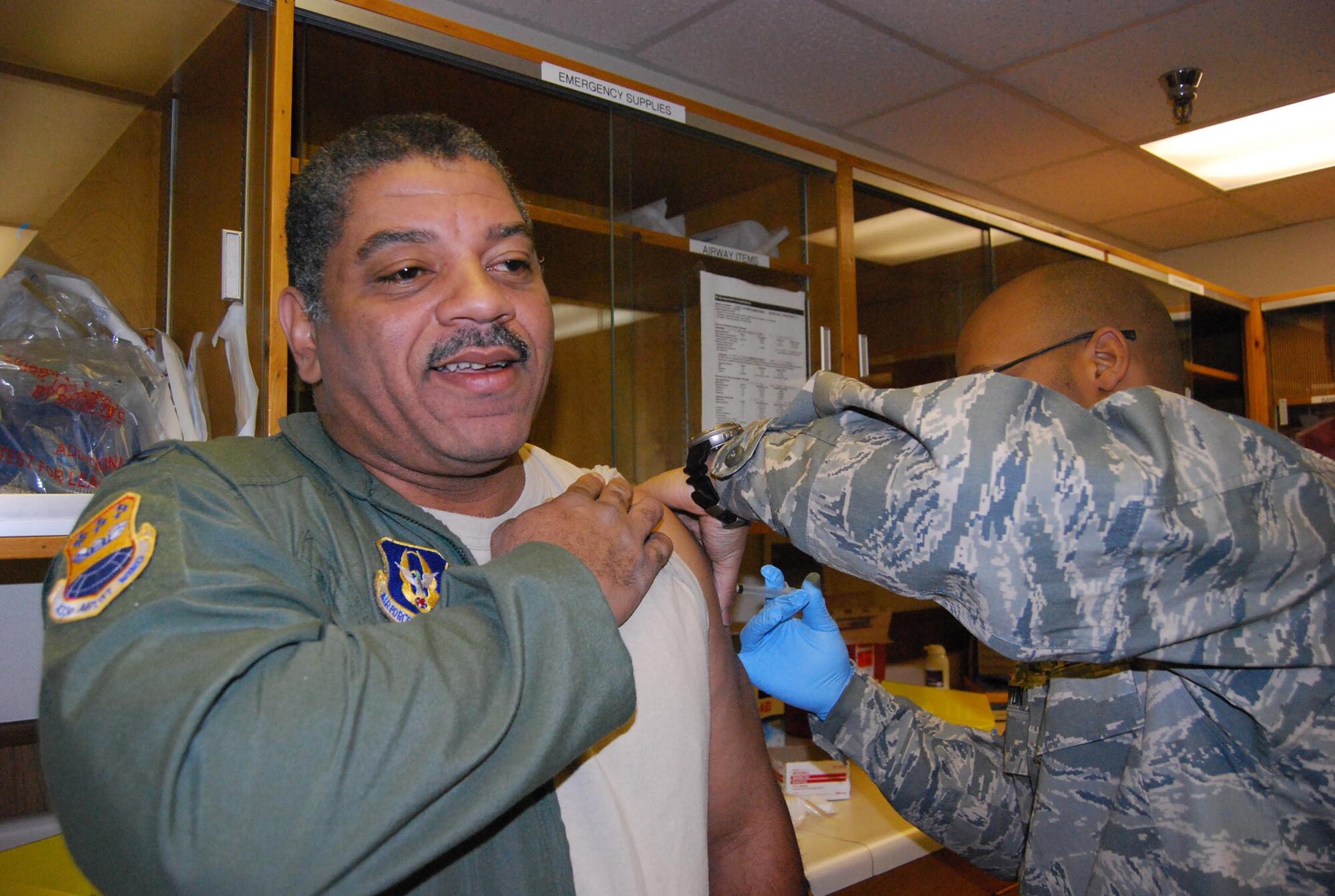 Members of the 433rd Medical Squadron administer the H1N1 immunization to fellow reservists during the B Unit Training Assembly. This immunization is mandatory for all uniformed members, If you haven't recieved yours, get with your Unit Health Monitor. (U.S. Air Force photo by Senior Airman Viola M Hernandez)