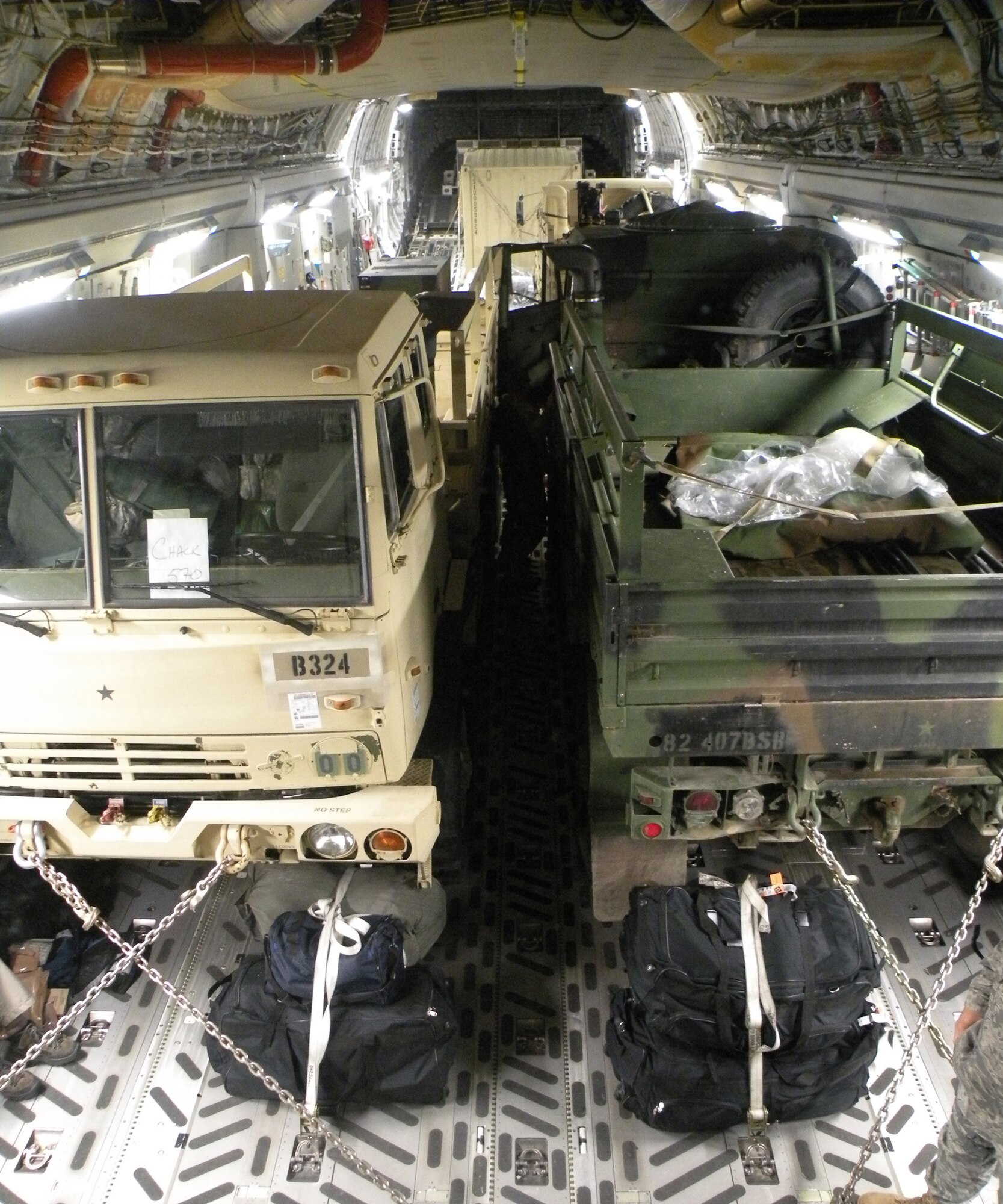 A Reserve flight crew from the 317th Airlift Squadron, Charleston Air Force Base, N.C., fly more than 80,000 pounds of cargo to Haiti on a C-17 Globemaster III in support of Operation Unified Response during the early morning hours of Jan. 22, 2010. (U.S. Air Force Photo/Master Sgt. Steve Staedler)   