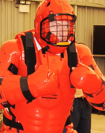 Airman 1st Class Joshua Long, a security forces journeyman with the 380th Expeditionary Security Forces Squadron, wears a "red man" suit during security forces training at a non-disclosed location in Southwest Asia on Jan. 22, 2010. Security forces Airmen were training force protection Airmen on baton certification. During the training, they used simulated batons to learn the tactics, techniques and procedures for their use. Security forces Airmen receive training such as this at regional training centers such as the U.S. Air Force Expeditionary Center at Joint Base McGuire-Dix-Lakehurst, N.J., in courses such as the Phoenix Warrior Training Course and the Phoenix Raven Training Course. Airman Long is deployed from the 437th Security Forces Squadron at Charleston Air Force Base, S.C., and his hometown is Berlin, Conn. (U.S. Air Force Photo/Tech. Sgt. Scott T. Sturkol/Released)