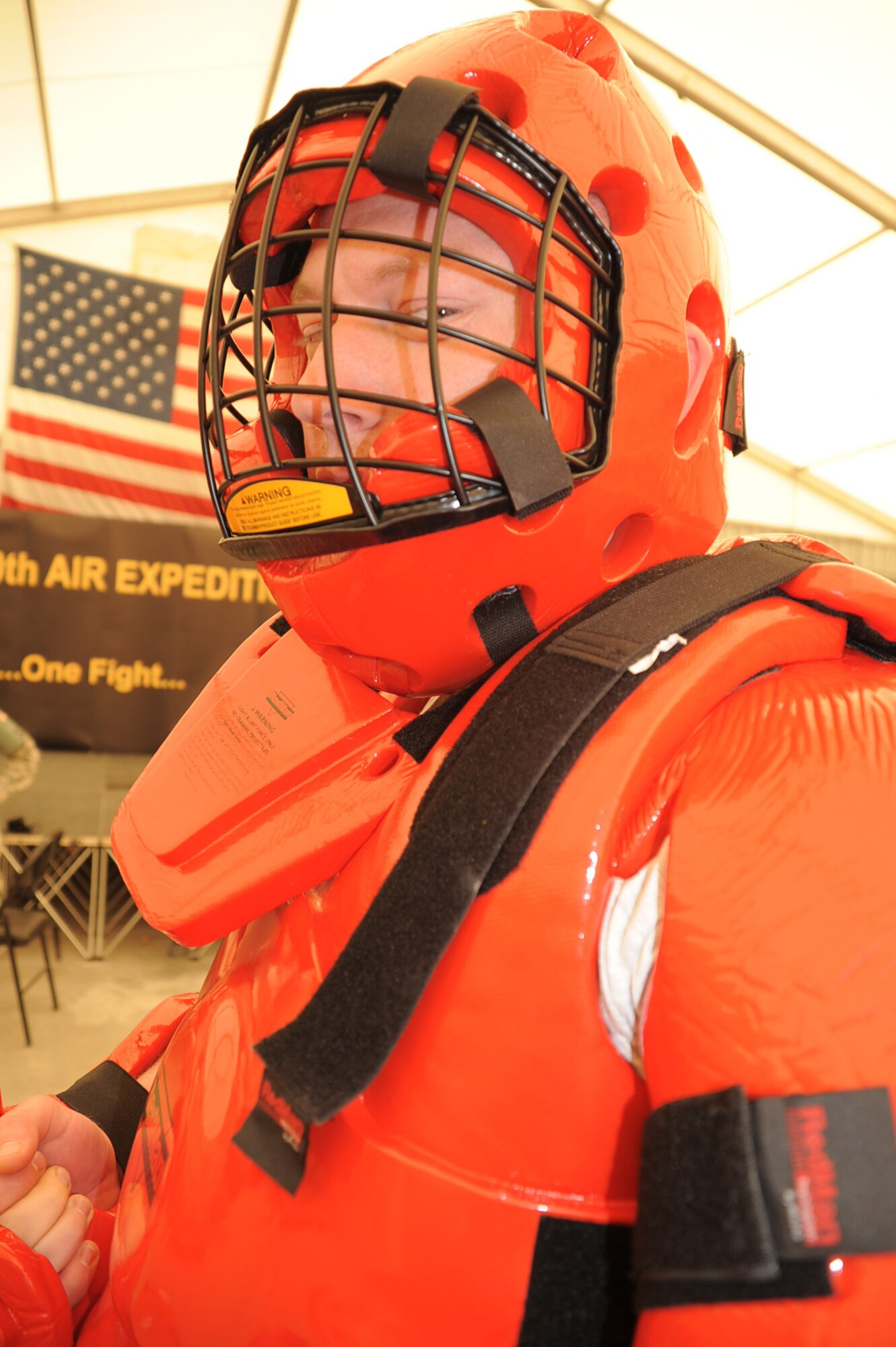 Airman 1st Class Joshua Long, a security forces journeyman with the 380th Expeditionary Security Forces Squadron, wears a "red man" suit during security forces training at a non-disclosed location in Southwest Asia on Jan. 22, 2010. Security forces Airmen were training force protection Airmen on baton certification. During the training, they used simulated batons to learn the tactics, techniques and procedures for their use. Security forces Airmen receive training such as this at regional training centers such as the U.S. Air Force Expeditionary Center at Joint Base McGuire-Dix-Lakehurst, N.J., in courses such as the Phoenix Warrior Training Course and the Phoenix Raven Training Course. Airman Long is deployed from the 437th Security Forces Squadron at Charleston Air Force Base, S.C., and his hometown is Berlin, Conn. (U.S. Air Force Photo/Tech. Sgt. Scott T. Sturkol/Released)