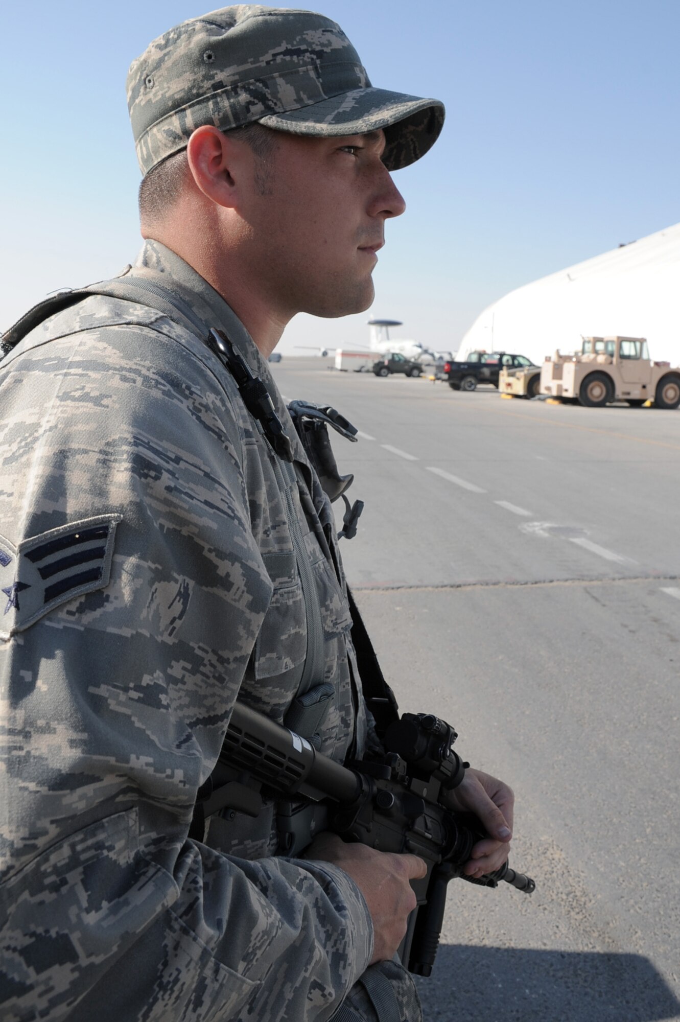 Senior Airman James Assett, security forces journeyman with the 380th Expeditionary Security Forces Squadron at a non-disclosed base in Southwest Asia, watches over a checkpoint during operations near the flightline Jan. 22, 2010.  Airman Asseff is deployed from the 96th Security Forces Squadron at Eglin Air Force Base, Fla., and his hometown is Lorain, Ohio.  (U.S. Air Force Photo/Tech. Sgt. Scott T. Sturkol/Released)