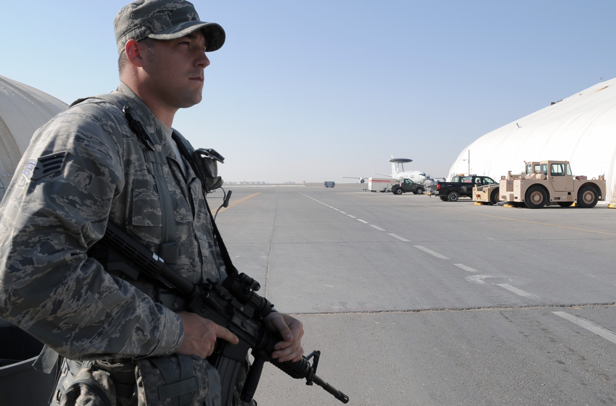 Senior Airman James Assett, security forces journeyman with the 380th Expeditionary Security Forces Squadron at a non-disclosed base in Southwest Asia, watches over a checkpoint during operations near the flightline Jan. 22, 2010.  Airman Asseff is deployed from the 96th Security Forces Squadron at Eglin Air Force Base, Fla., and his hometown is Lorain, Ohio.  (U.S. Air Force Photo/Tech. Sgt. Scott T. Sturkol/Released)