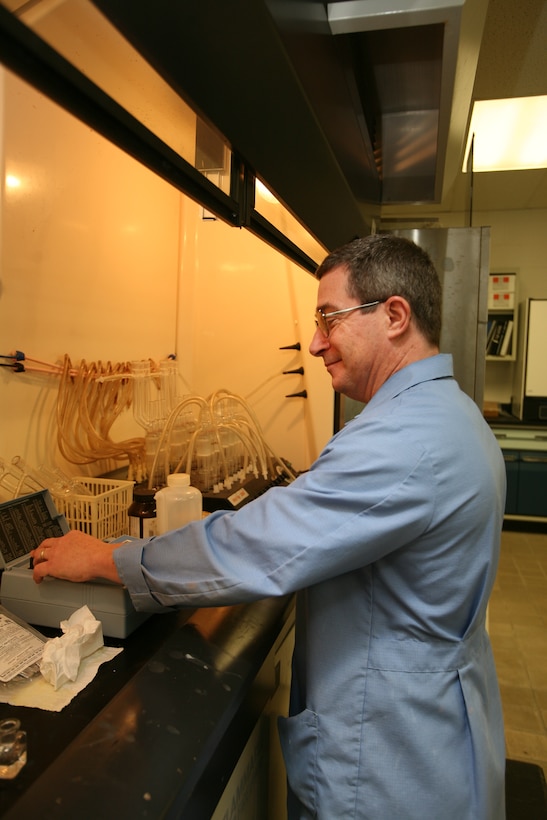 Mark Anderson, a physical science technician at Cherry Point’s water treatment plant, tests a water sample for iron. Technicians test the water hourly to make sure that it is in keeping with North Carolina’s Environmental Protection Agency regulations.