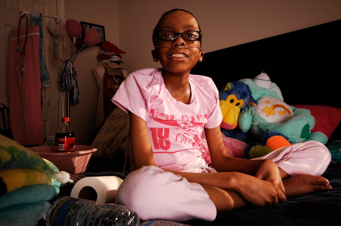 After returning from the hospital early January, Briana Menendez, 13, an Honorary Marine, spends the majority of time at home resting in her room, which is decorated much to the tastes of a young teenage girl. Along with an oxygen tank and hospice supplies, the room is complete with dozens of balloons and stuffed animals.