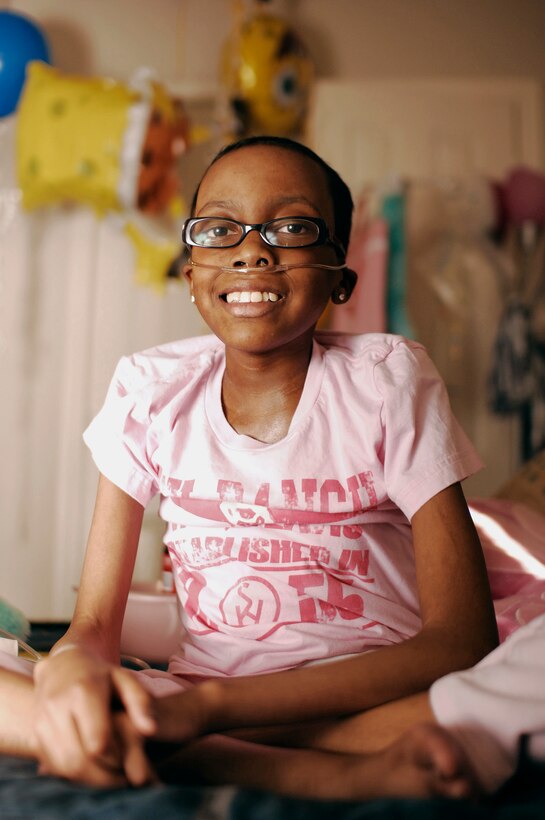 Briana Menendez, 13, an honorary Marine, poses in her bedroom at her home in Fort Worth, Texas Jan. 25. Briana passed away peacefully in her bed Jan. 27 due to her leukemia.