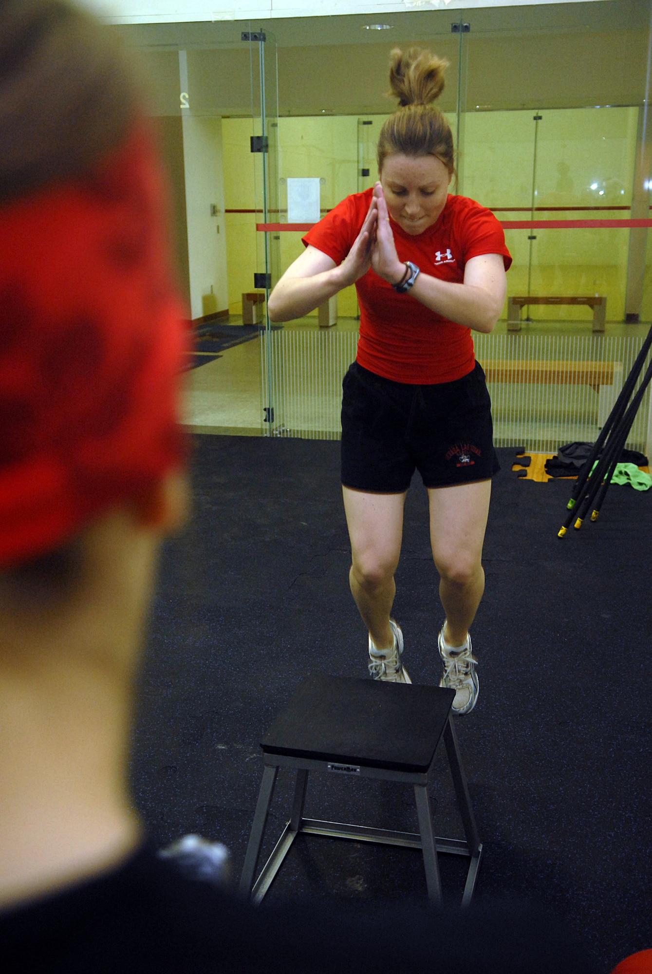 KUNSAN AIR BASE, Republic of Korea -- 1st Lt. Melissa Thurman, 8th Fighter Wing, jumps up on a box during a CrossFit work out at the fitness Center Jan. 23. CrossFit's purpose is to move large loads over long distances, and to do so quickly. (U.S. Air Force photo/Senior Airman Roy Lynch)