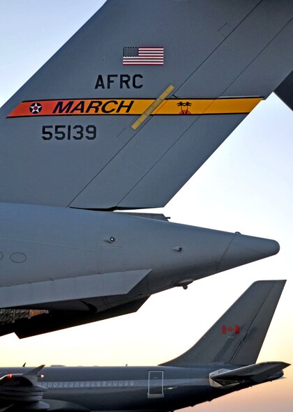 A C-17 aircraft from March Air Reserve Base, Calif., sits on the ramp at Haiti’s Port-au-Prince airport Jan. 22, where it delivered 15 members of the 419th Fighter Wing’s 67th Aerial Port Squadron. Hill’s 67th APS reservists, all volunteers, will be deployed to Port-au-Prince for at least 45 days to help restore airfield operations and pave the way for increased humanitarian aid.  (U.S. Air Force photo/Kari Tilton)