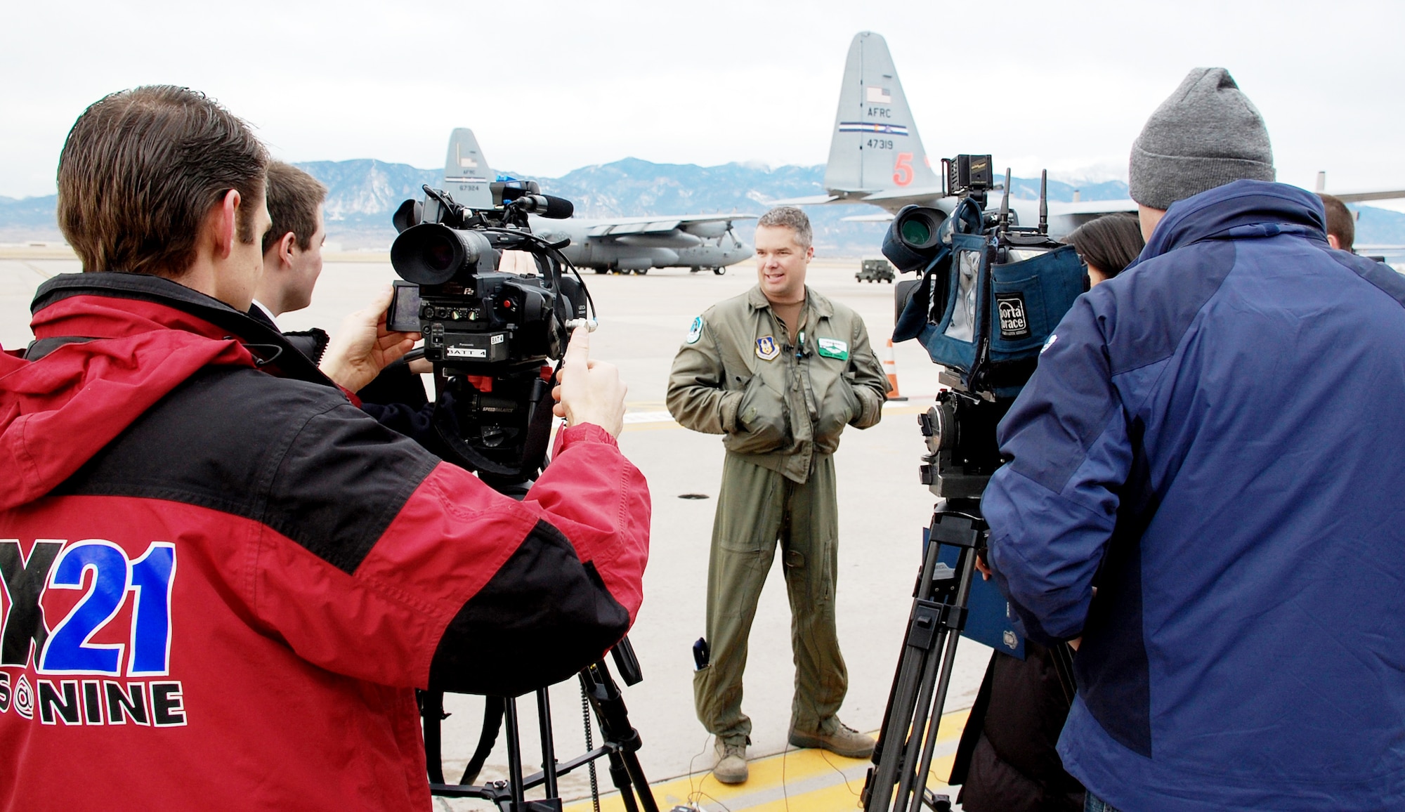 Maj. Brad James meets with Colorado Springs, Colo., media before departing in support of Operation Coronet Oak Jan. 22, 2010, from Peterson Air Force Base, Colo. Two C-130 Hercules and approximately 50 Air Force reservists from the 302nd Airlift Wing left Colorado to fly missions out of Puerto Rico in support of Haitian relief efforts. Major James is a 731st Airlift Squadron pilot. (U.S. Air Force photo/Tech. Sgt. Daniel Butterfield)
