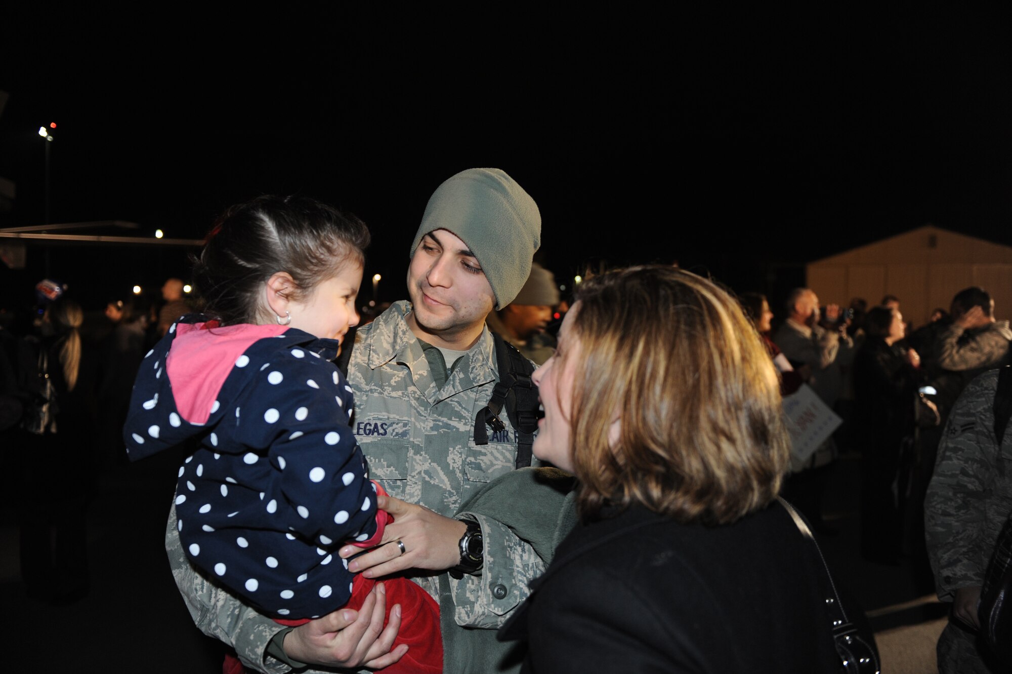 SHAW AIR FORCE BASE, S.C. -- Staff Sgt. David Villegas reunites with his wife, Michelle, and daughter, Abigail. Hundreds of Airmen assigned to the 79th 20th Fighter Wing returned this week after a four-month deployment in support of NATO efforts in Afghanistan.  (U.S. Air Force Photo/Tech. Sgt. Louis Rivers)