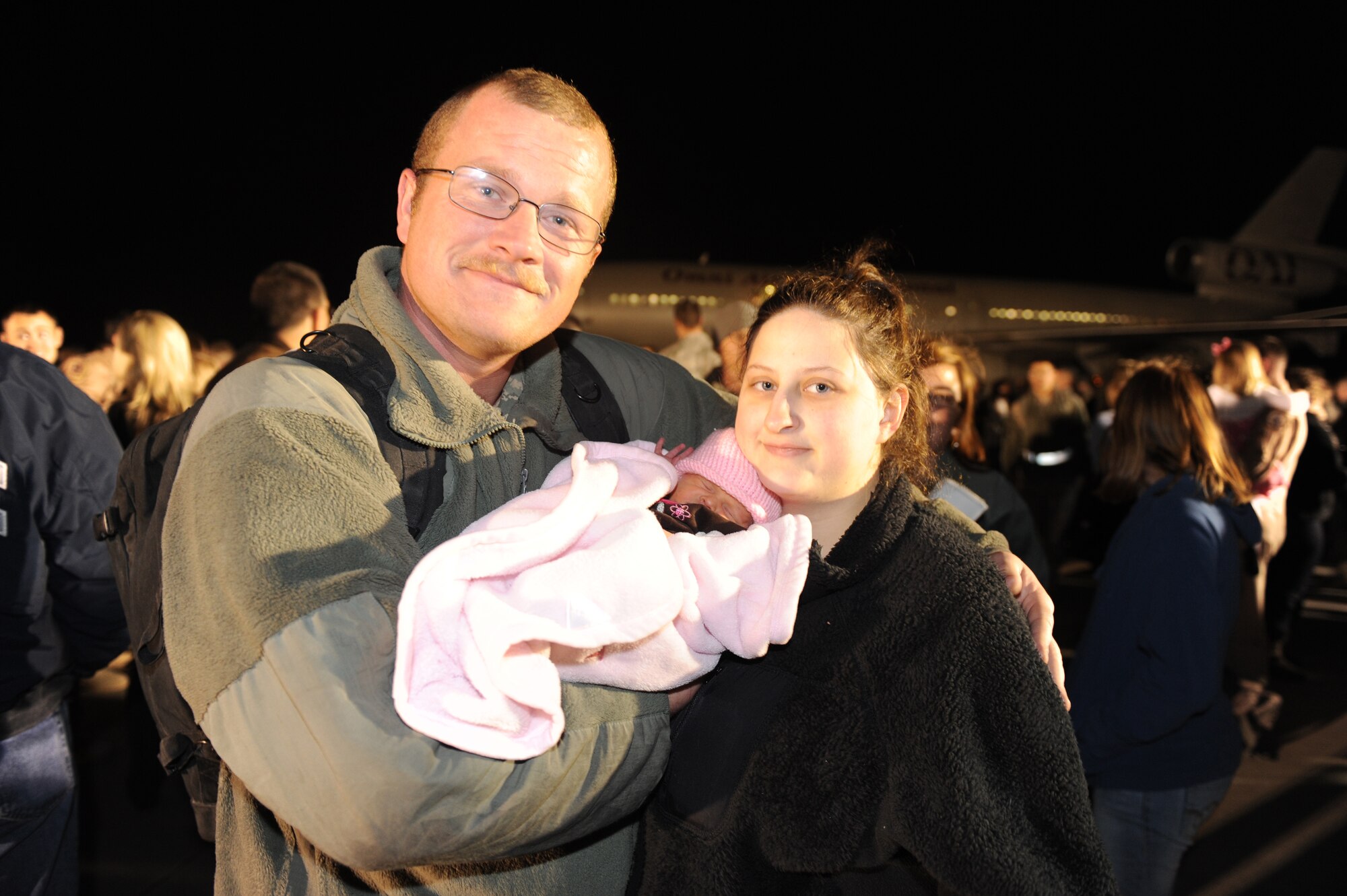 SHAW AIR FORCE BASE, S.C. -- Staff Sgt. Corey Riley reunites with his wife, Tia, and son, Jacob. Hundreds of Airmen assigned to the 20th Fighter Wing returned this week after a four-month deployment in support of NATO efforts in Afghanistan.  (U.S. Air Force Photo/Tech. Sgt. Louis Rivers)