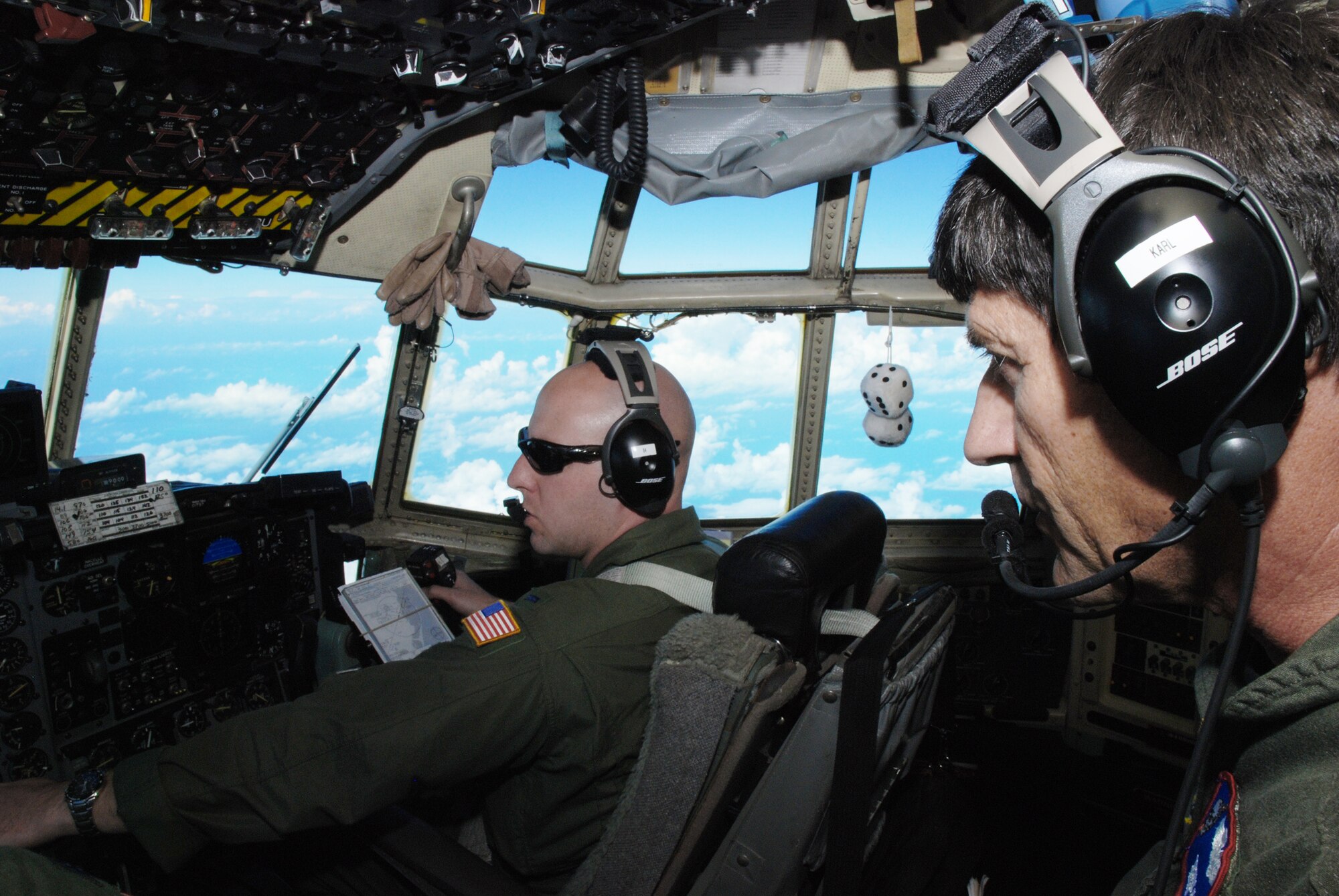 Senior Master Sgt. Dennis Karl, a C-130 Hercules flight engineer, and 1st Lt.Casey Fallon, a C-130 co-pilot, were serving on their scheduled Coronet Oak rotation with the 35th Expeditionary Airlift Squadron at Muniz Air National Guard Base, Puerto Rico, when an alert was issued after the earthquake in Haiti. Both Airmen are Guardsmen with the 179th Airlift Wing at Mansfield, Ohio.  Their Jan. 22 flight was their sixth mission in support of Operation Unified Response. (U.S. Air Force photo/Master Sgt. Stan Coleman)