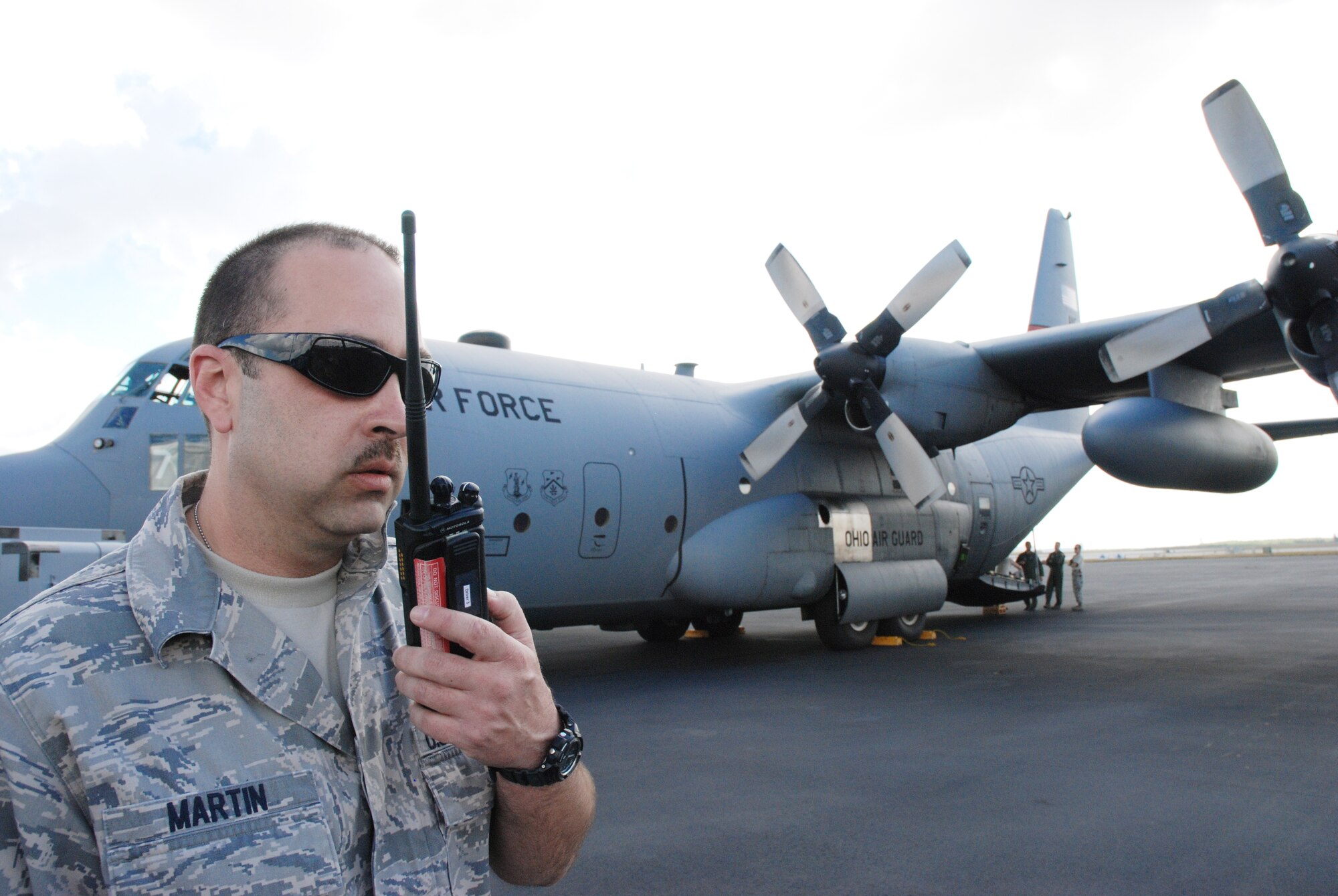 Master Sgt. Heath Martin, a 94th Maintenance Squadron crew chief from Dobbins Air Reserve Base, Ga., provides transient alert support Jan. 22, 2010, to Operation Unified Response aircraft at Homestead Air Reserve Base, Fla.  Various airlift aircraft, including Air Force Reserve Command and Air National Guard C-130 Hercules, provided disaster-relief airlift to Haiti. (U.S. Air Force photo/Master Sgt. Stan Coleman) 