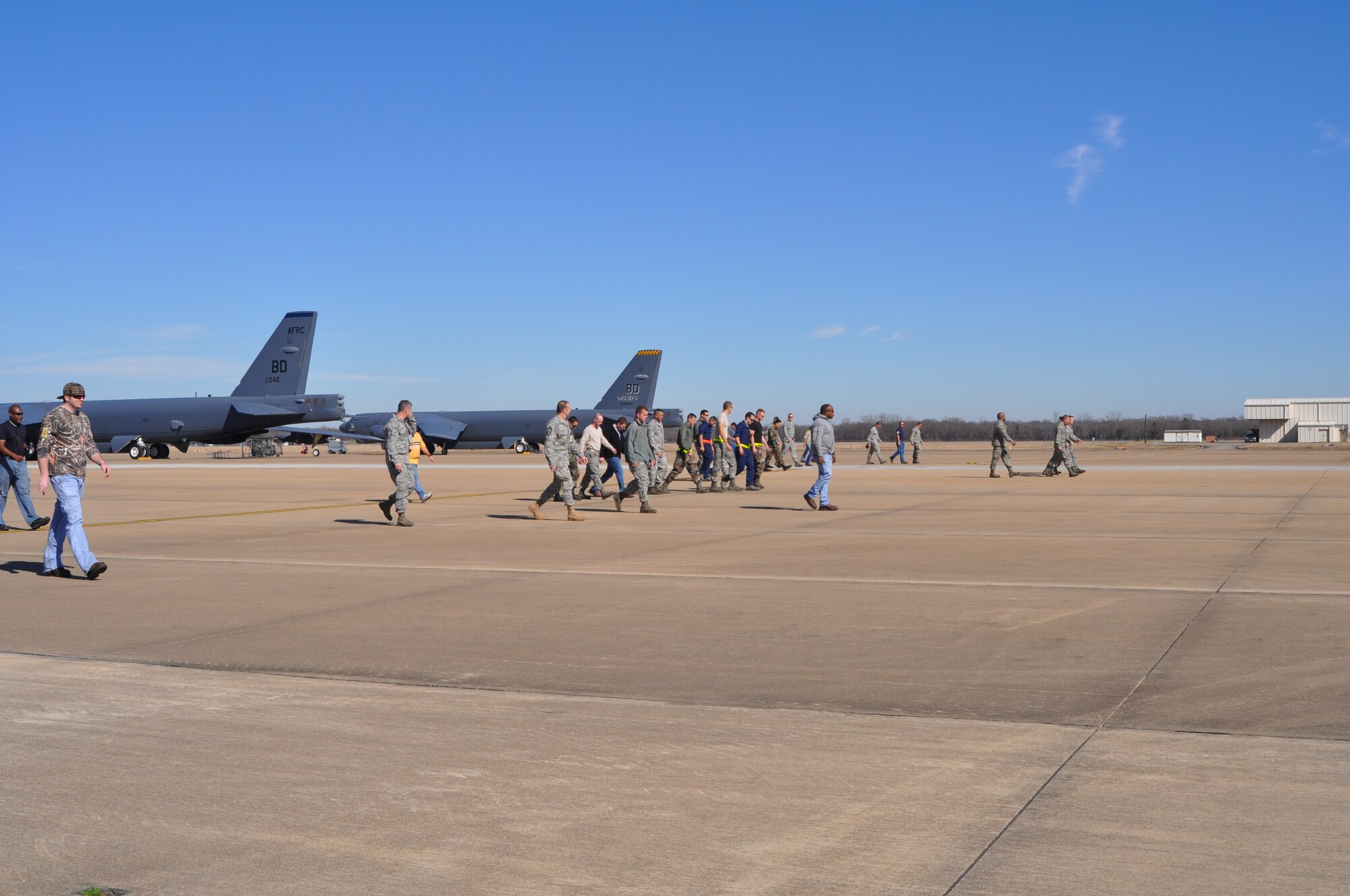 The 917th Aircraft Maintenance Squadron on Barksdale Air Force Base, La., made up of both 917th personnel and Regular Air Force members attached to the unit, conducts a foreign object damage (FOD) walk on Barksdale’s flight line Jan. 22, 2010. The 917th AMXS walk the flight line every Friday, collecting any type of FOD, and removing it in order to minimize the chances of damage to aircraft on base. FOD has the ability to cause harm to the aircraft by tearing the vehicle’s tires or being ingested into the engine, causing costly internal damage.  (U.S. Air Force Photo/Senior Airman Crystal Marie Jordan)