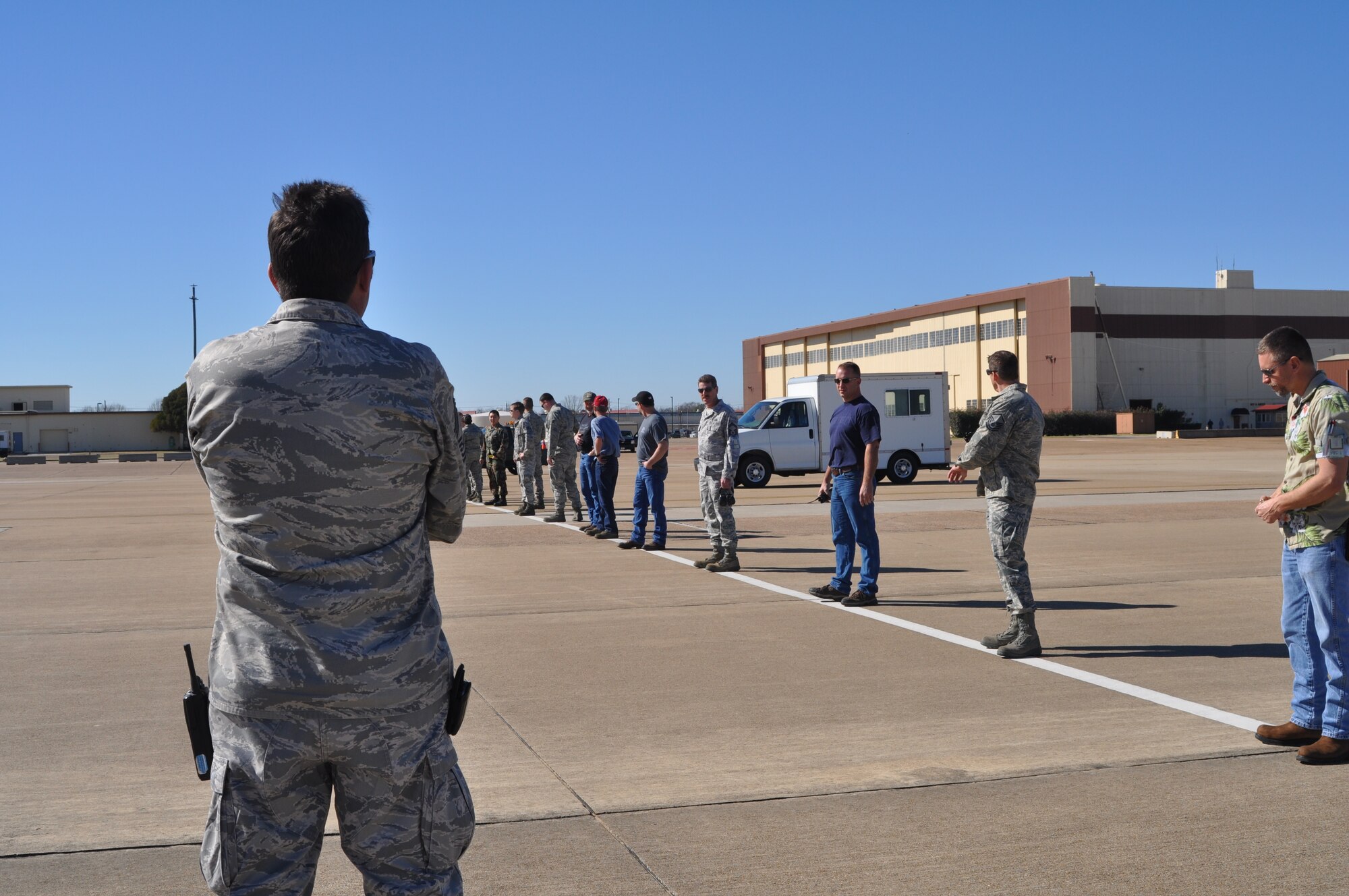 Senior Master Sgt. Thomas Hoffman, a 917th Aircraft Maintenance Squadron superintendent on Barksdale Air Force Base, La., prepares to give the order to begin a foreign object damage (FOD) walk on Barksdale Jan. 22, 2010. The 917th AMXS, made up of both 917th personnel and Regular Air Force members attached to the unit, conduct a FOD walk every Friday in order to minimize the chances of damage to aircraft on Barksdale. Rocks, broken pavement or garbage are all considered to be FOD and have to be removed from the flight line.  These objects could cut into aircraft tires, become ingested into the engine of the aircraft or could possibly be thrown by jet blast, damaging planes or injuring personnel. (U.S. Air Force Photo/Senior Airman Crystal Marie Jordan)