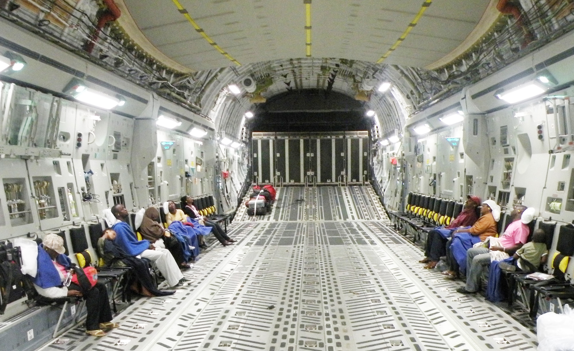 Sixteen Haitian passengers are asleep minutes after takeoff on a C-17 Globemaster III from Haiti enroute to Orlando, Fla., during the early morning hours of Jan. 22, 2010. The Travis Air Force Base, Calif.-based aircraft was flown by reservists from the 317th Airlift Squadron from Charleston AFB, S.C. (U.S. Air Force photo/Master Sgt. Steve Staedler) 