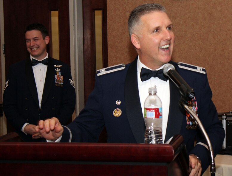 TRAVIS AIR FORCE BASE, Calif. -- It’s was the occasion of the year for the members of the 349th Air Mobility Wing; this night where the wing members are recognized for their accomplishments and contributions to the wing mission. It’s was the 349th Annual Awards Banquet, Jan 23.  More than 200 community leaders, wing members, their families and friends came together to celebrate the daily endeavors of wing members that were there to be honored.  
Col. John C. Flournoy, 349th Air Mobility Wing commander, congratulates the 349th AMW Annual Award winners at the Delta Breeze Club here Saturday while one of the emcee’s, Staff Sgt. Christopher Dempsey, looks on. (U.S. Air Force photo/Master Sgt. Robert Wade)