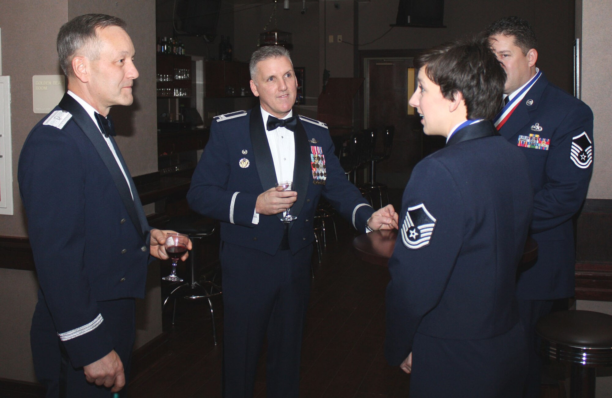 TRAVIS AIR FORCE BASE, Calif. -- Maj. Gen. (Sel) Eric W. Crabtree, 4th Air Force commander, and Col. John C. Flournoy, 349th Air Mobility Wing commander, speak with Master Sgt. Heather A. Bradley and Master Sgt. Scott D. Reichert, both Senior NCO of the Year nominees Saturday at the Delta Breeze Club. It’s was the occasion of the year for the members of the 349th Air Mobility Wing; this night where the wing members are recognized for their accomplishments and contributions to the wing mission. It’s was the 349th Annual Awards Banquet, Jan 23.  Maj. Gen. (Sel) Eric W. Crabtree, 4th Air Force commander, was the guest speaker at the 349th Air Mobility Wing Annual Awards Banquet held at the Delta Breeze Club, Jan. 23. More than 200 community leaders, wing members, their families and friends came together to celebrate the daily endeavors of wing members that were there to be honored.  (U.S. Air Force photo/Master Sgt. Robert Wade)